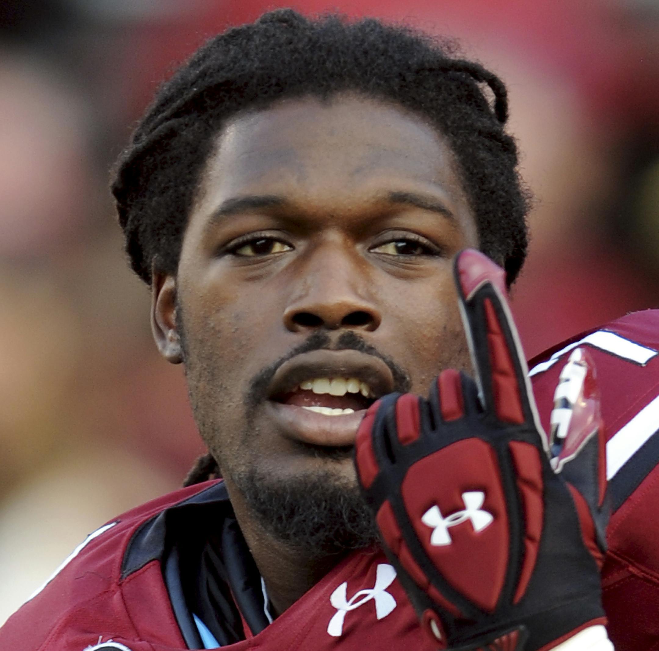 FILE - In this Sept. 14, 2013, file photo, South Carolina defensive end Jadeveon Clowney gestures as he stretches before an NCAA college football game against Vanderbilt in Columbia, S.C. The NFL's first May draft means a couple of more weeks to critique the prospects — such as Clowney — and figure out who is going where and when. No player has been more scrutinized than Clowney, the defensive end from South Carolina, whose every move has been analyzed since the end of his sophomor