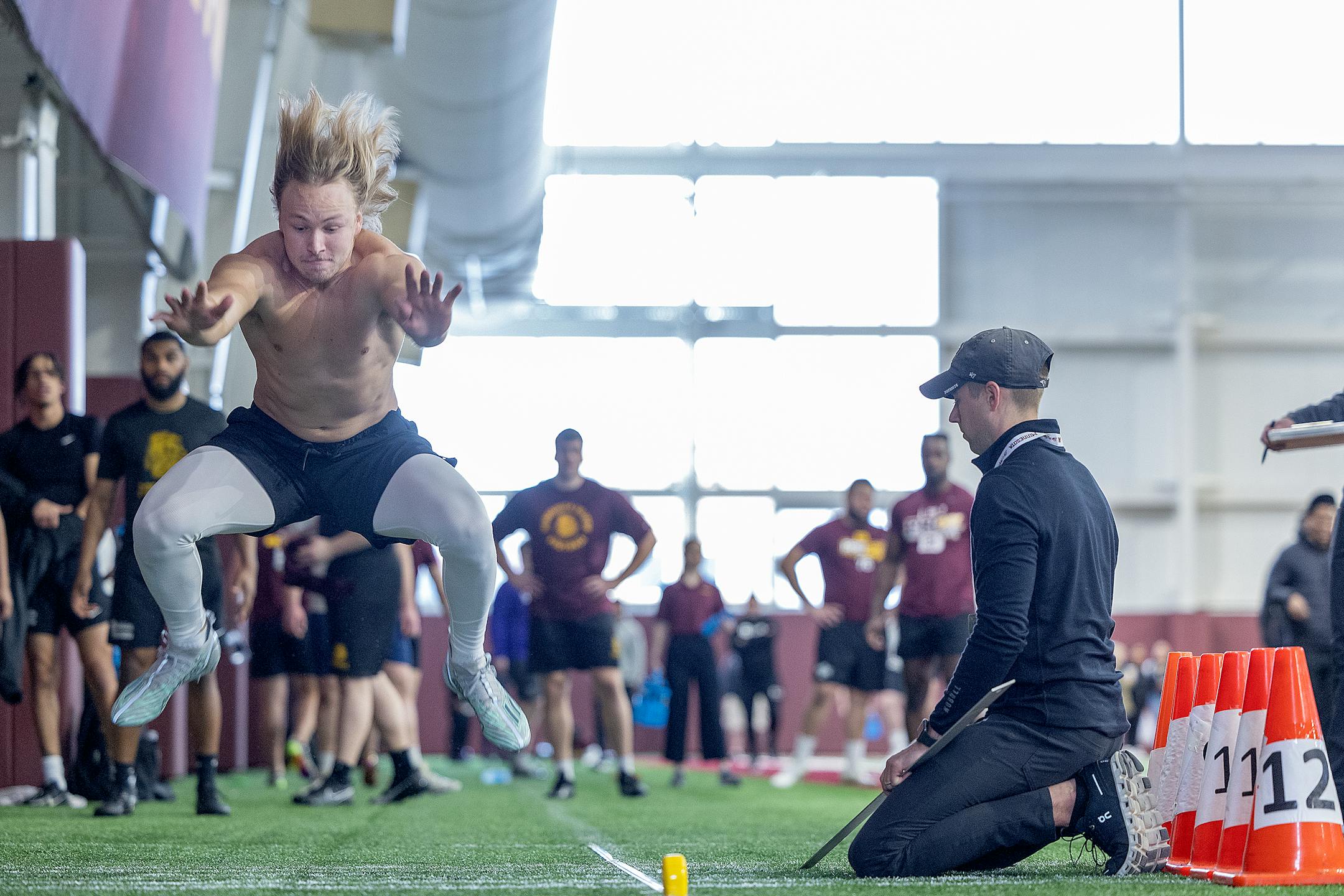 Brock Annexstad jumps the long jump for scouts during the Minnesota Pro Day.