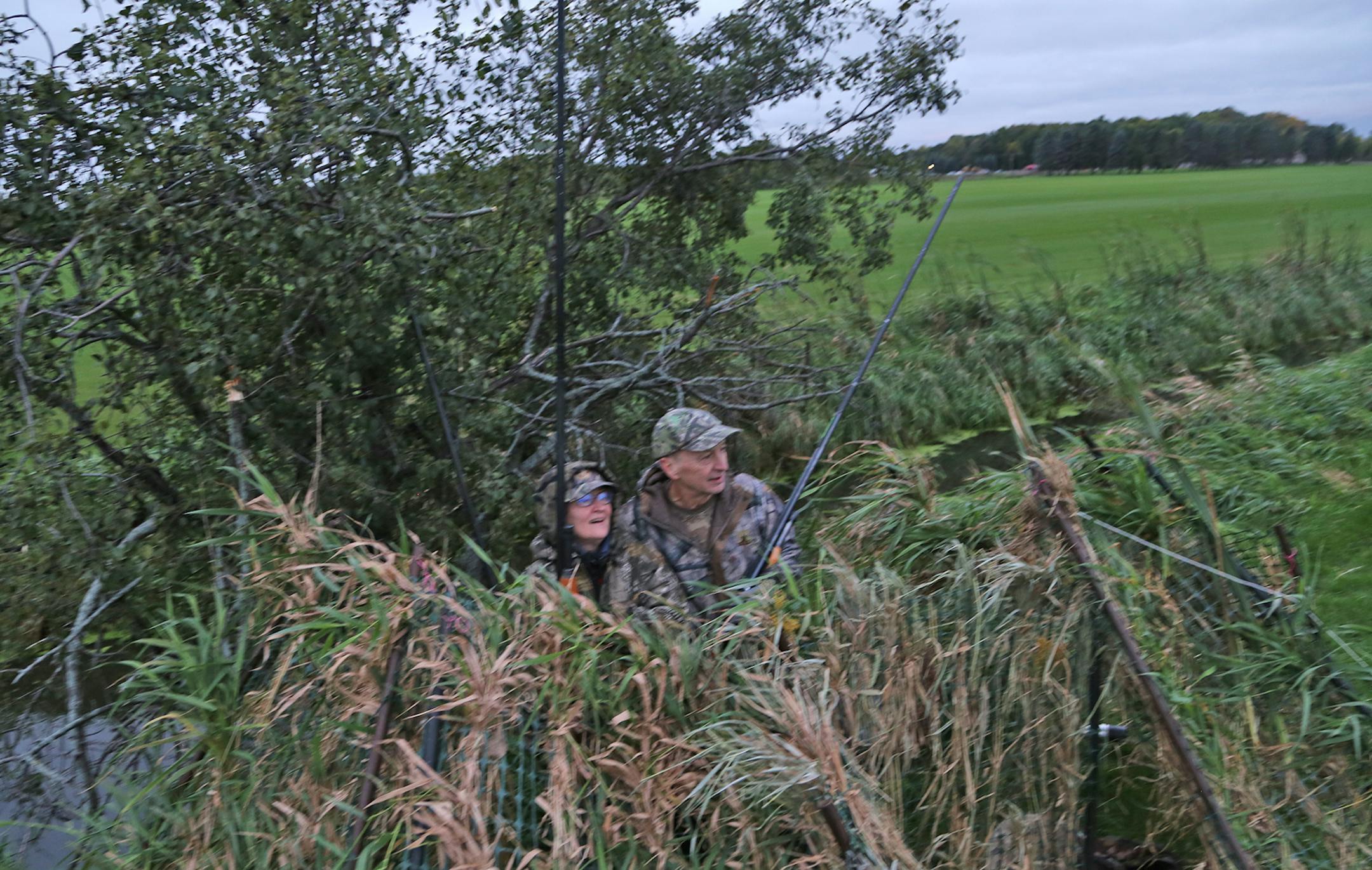 Wendell and Galina Diller of Oakdale deply shotguns with 7-foot-lond barrels. Wendell Diller invented the sound-reducing barels, which when combined with subsonic shells discharge with the aplmitude of a man's cough.