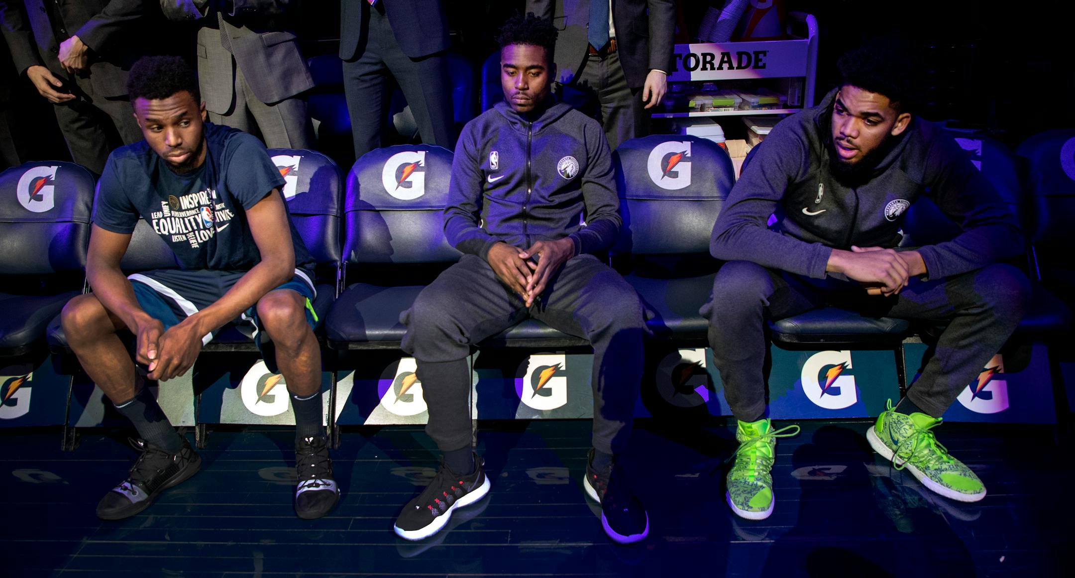 The Timberwolves' Andrew Wiggins, Kelan Martin and Karl-Anthony Towns waited to be announced during team introductions a day after five teammates were traded away.