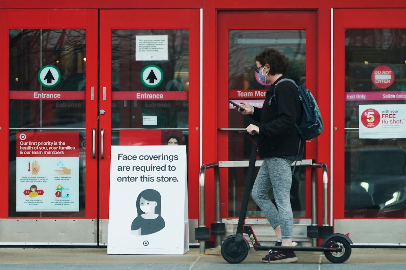 A face covering required sign shows in front of a Target store in Arlington Heights, Ill., Thursday, Nov. 5, 2020. Illinois recorded new cases of coronavirus illness Wednesday and it's the next-to-highest single-day count since the pandemic hit Illinois in February. (AP Photo/Nam Y. Huh) ORG XMIT: MER1289f651949459dd0db124d2e9e6d