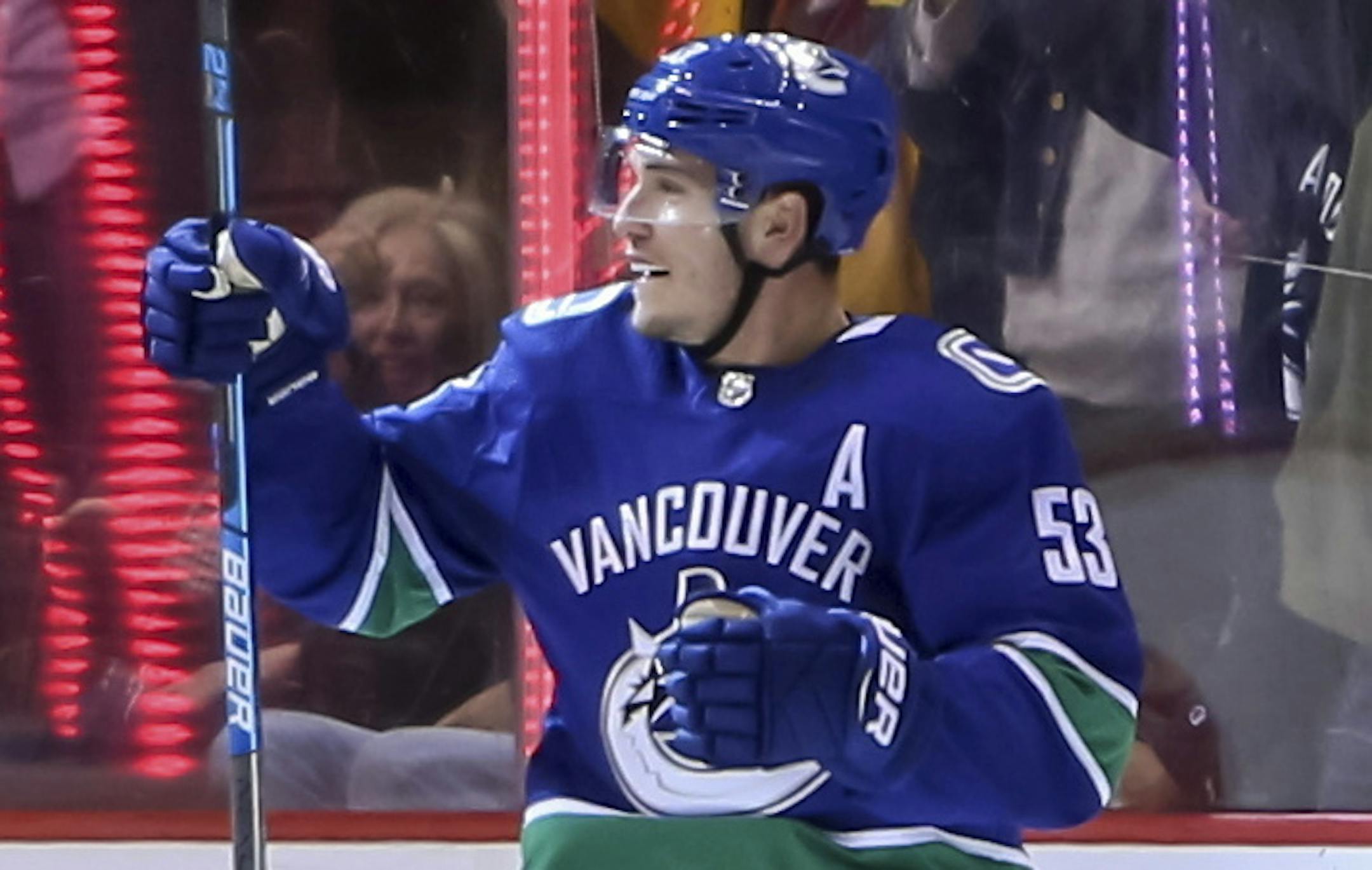 Vancouver Canucks' Bo Horvat (53) celebrates his goal with teammate Alex Biega (55) during first period NHL hockey action against the Dallas Stars, in Vancouver, British Columbia, on Saturday, Dec. 1, 2018. (Ben Nelms/The Canadian Press via AP)