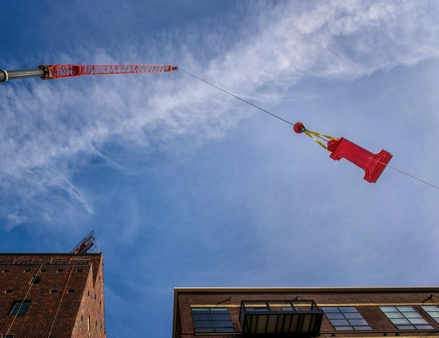 The letter i is hoisted to the Mill roof. ] GLEN STUBBE * gstubbe@startribune.com Tuesday, October 20, 2015 The St. Anthony Main strip and A Mill Artists Lofts is getting its Pillsbury mojo back. Work is underway to reinstall the 30-foot tall Pillsbury's Best Flour sign, which sits atop a red tile silo building connected to the Pillsbury Mill. Owen Metz, of Twin Cities-based developer Dominium which is restoring the sign, said removing, restoring and replacing the signs with new LED lighting wil