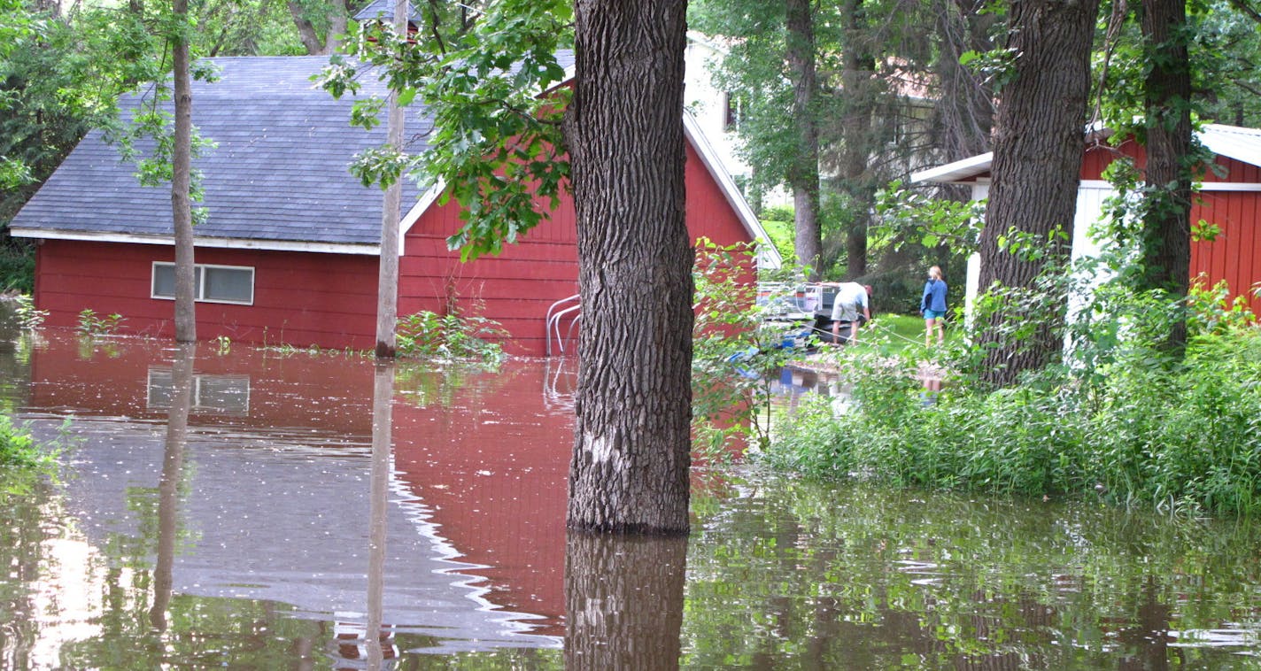 The swollen Mississippi River overwhelmed the levee in Newport, inundating several buildings and homes. The city declared a state of emergency last week, and waters were not expected to recede until the middle of next week.