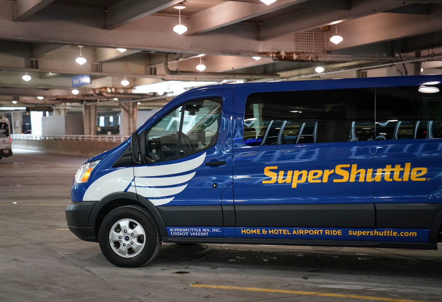 A SuperShuttle parked at the Minneapolis-St. Paul International Airport on Thursday, November 14, 2019.