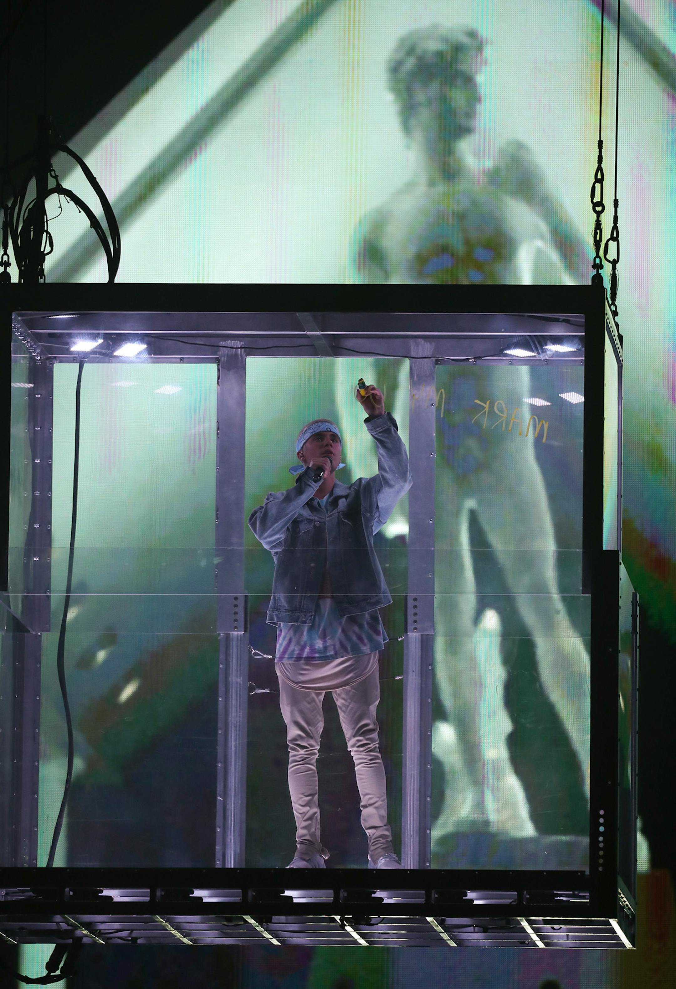 Justin Bieber wrote the words "Mark My Words" on the the clear box he was in at the beginning of his show at Target Center Sunday night.