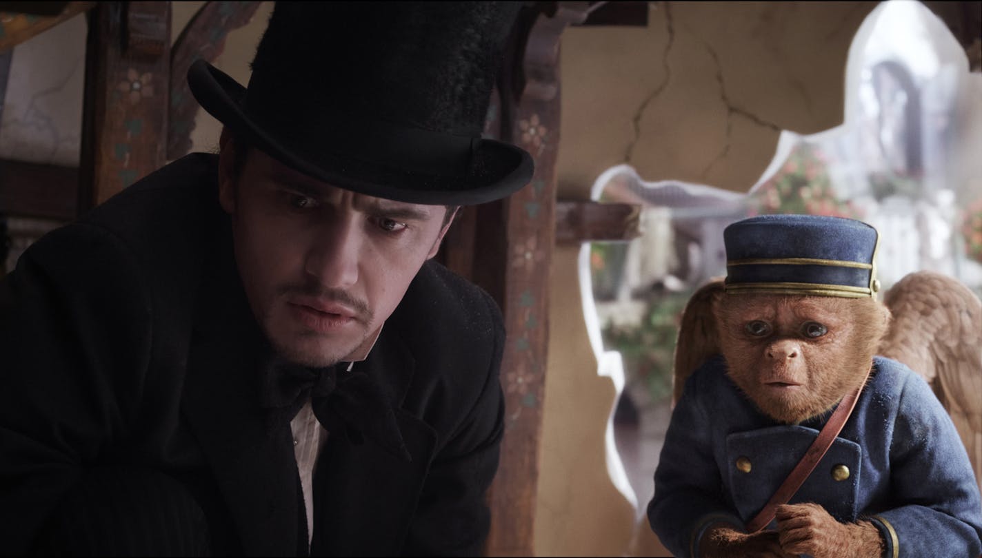 This film image released by Disney Enterprises shows James Franco, as Oz, left, and the character Finley, voiced by Zach Braff, are shown in a scene from "Oz the Great and Powerful." (AP Photo/Disney Enterprises) ORG XMIT: MIN2013030608554711