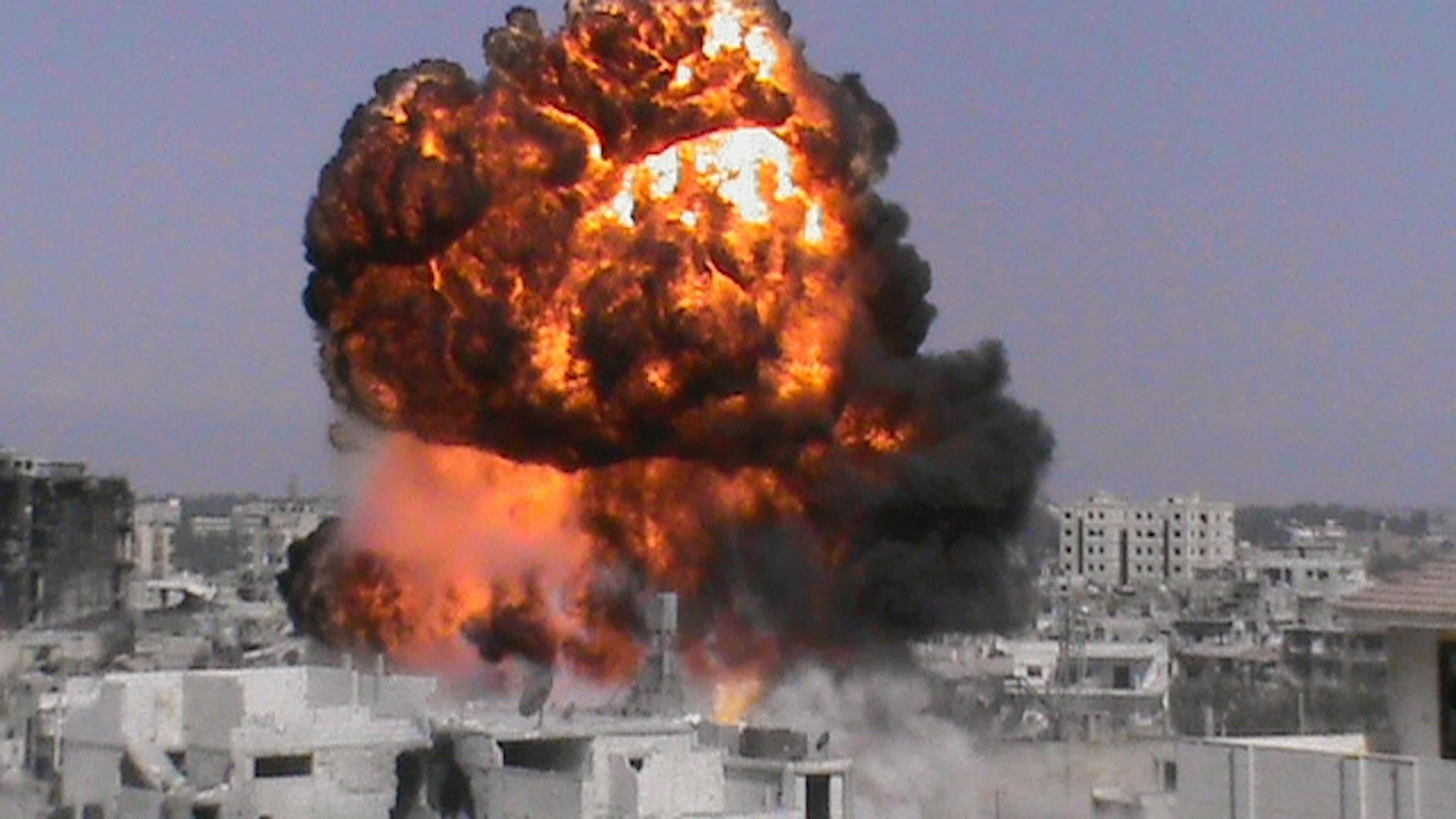 This citizen journalism image provided by Shaam News Network SNN, taken on Sunday, July 22, 2012, purports to show a fireball in Homs, Syria.