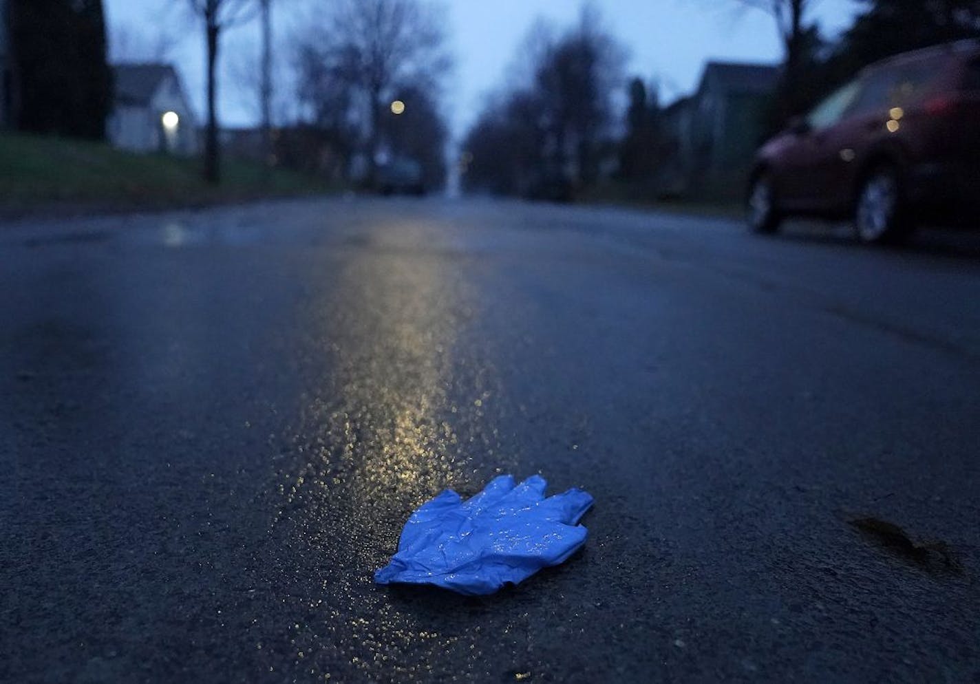 A man was fatally shot in north Minneapolis' Folwell neighborhood on Girard Ave. N. near N. Dowling Ave. early Tuesday, his death pushing the city's homicide total for the year to 77. Here, a medical glove lies discarded in the street, near where the man died of a gunshot wound Tuesday in Minneapolis.