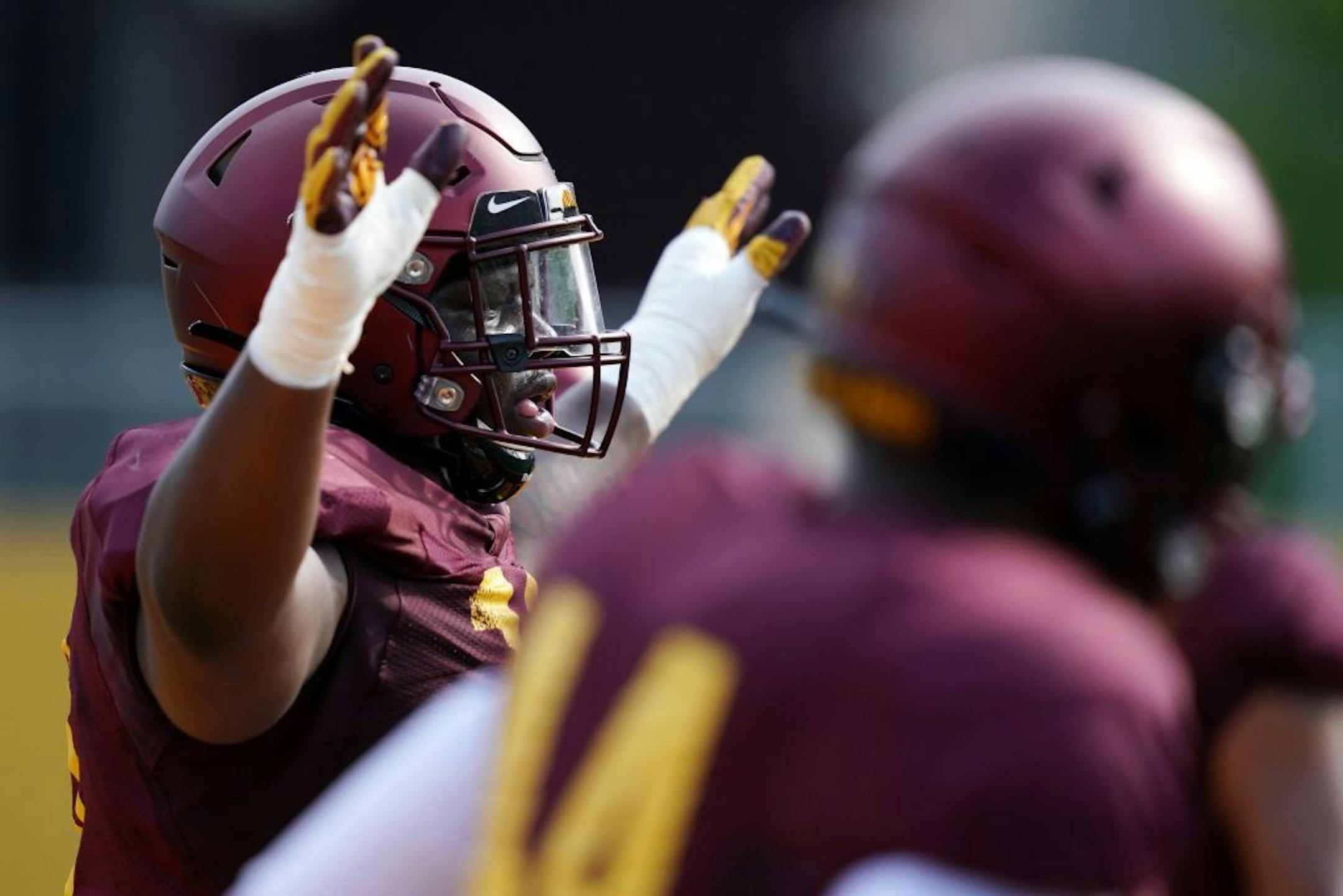 Minnesota Golden Gophers defensive tackle Micah Dew-Treadway (18) worked out with his teammates during practice Friday.