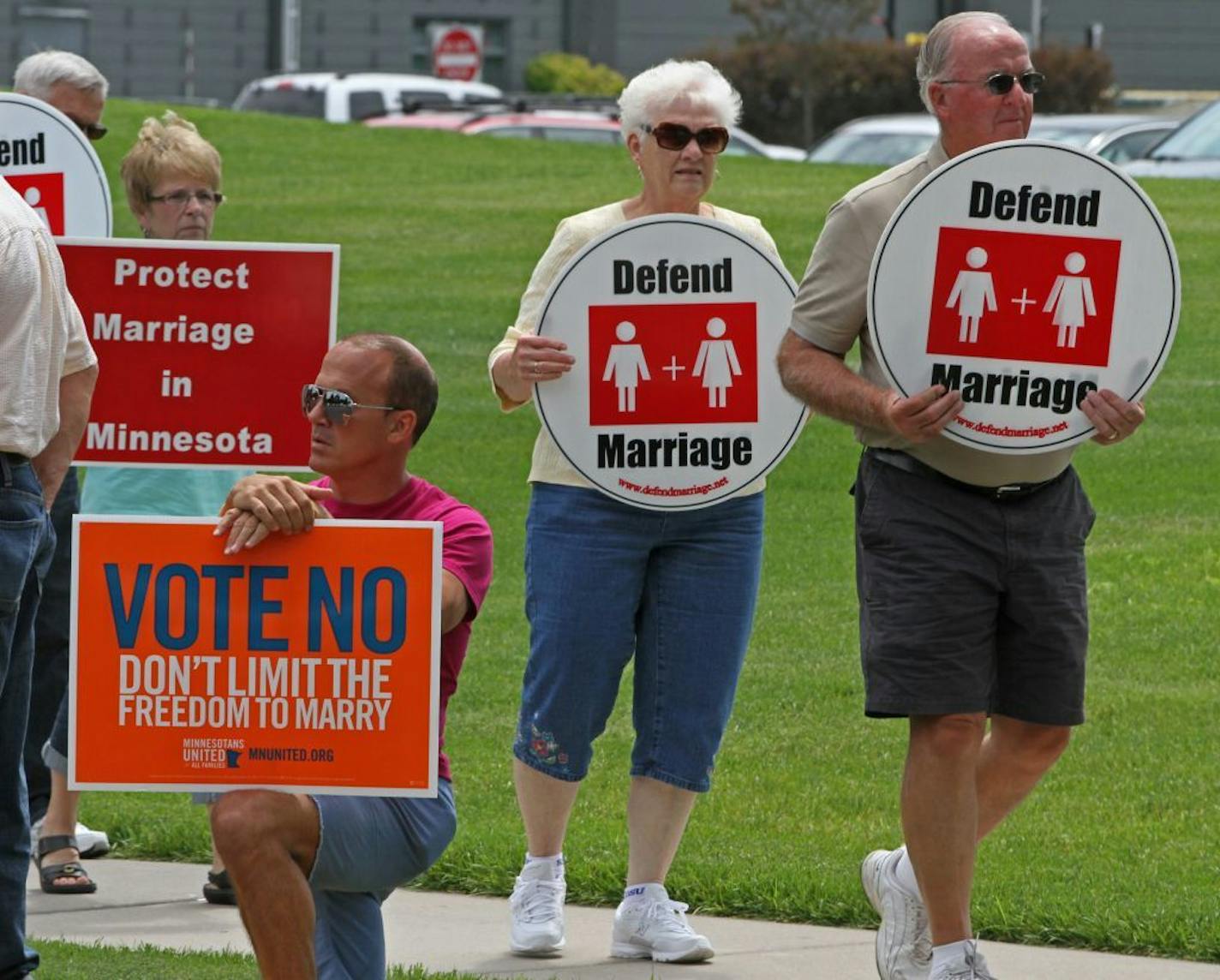 Around three dozen supporters for Minnesota for Marriage, the group pushing the marriage amendment, protested outside the General Mills headquarters in Golden Valley on 6/26/12. Their "Dump Gneral Mills" ralley from noon to 2 p.m. each day this week, is asking people to drop off General Mills products that will then be donated to local charity. A handfull of protestors against the marriage amendment also protested across the street from the Minnesota for Marriage supporters.