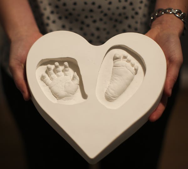 Chris and Amanda Duffy's baby girl Reese was born this November stillborn. The hospital made moldings of her hand and feet for the parents as a keepsa