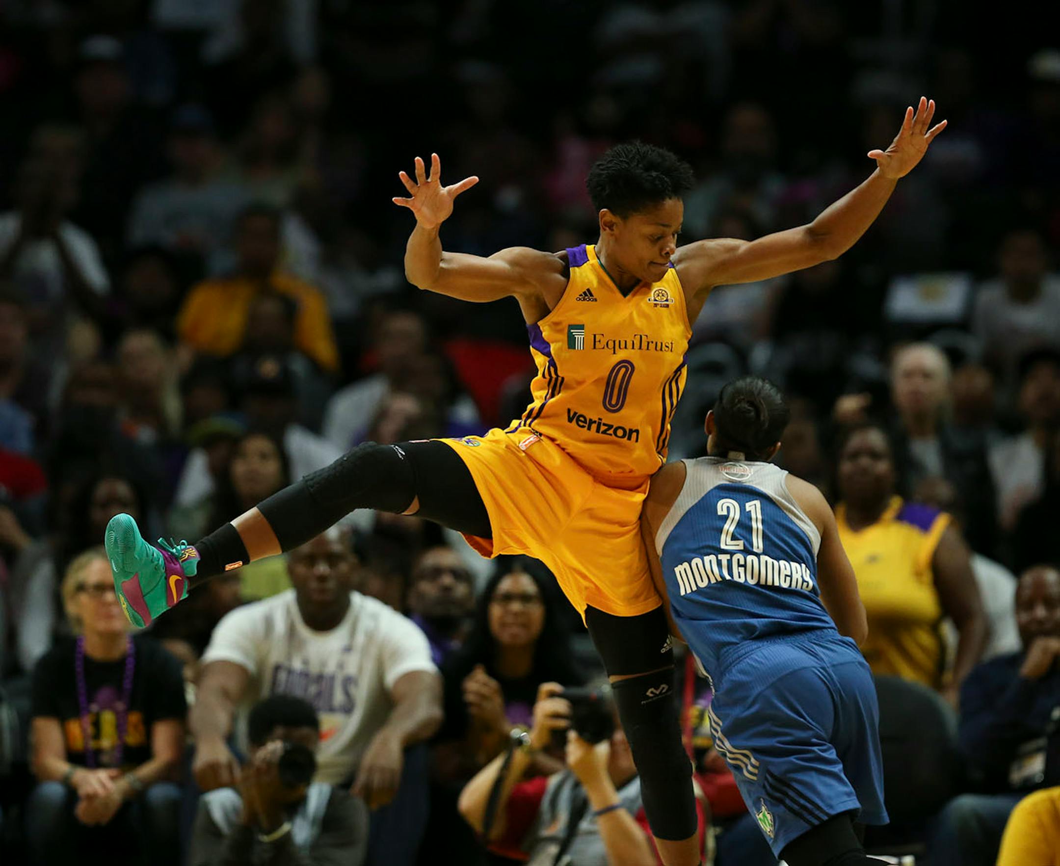 Los Angeles Sparks guard Alana Beard (0) fouled Minnesota Lynx guard Renee Montgomery (21) in the fourth quarter.