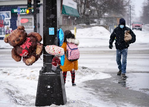 Balloons blow at a Memorial for Deshaun Hill Jr., 15, who was shot near the corner of Golden Valley Road and Penn Ave. N. Wednesday and died from his wounds Thursday and seen Friday, Feb. 11, 2022 in Minneapolis, Minn. ] DAVID JOLES • david.joles@startribune.com