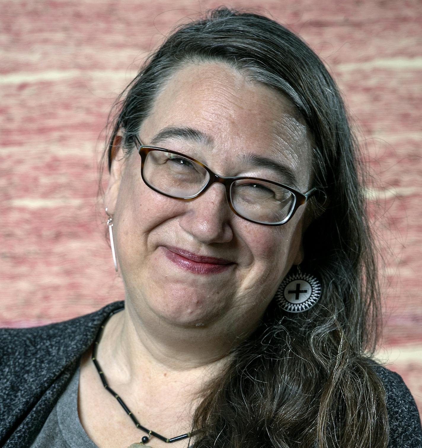 Minnesota's Artist of the Year Heid Erdrich photographed in front of her sister's art piece "Story of a Woman," by Louise Erdrich. ] ELIZABETH FLORES • liz.flores@startribune.com