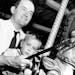Getting on the merry-go-round at the Minnesota State Fair in 1947 was an easy job for Mayor Hubert H. Humphrey and son Bobby. But getting off was hard
