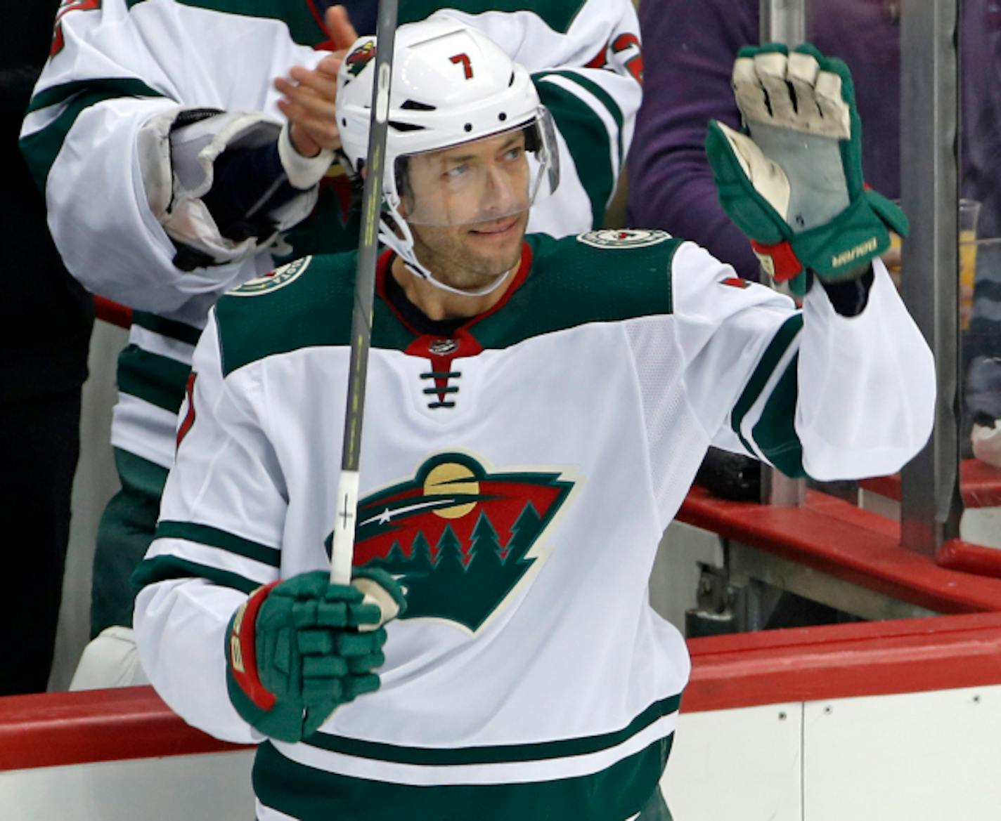 Minnesota Wild's Matt Cullen (7) acknowledges fans after a tribute to his time with the Pittsburgh Penguins during a timeout in the first period of an NHL hockey game in Pittsburgh, Thursday, Jan. 25, 2018. (AP Photo/Gene J. Puskar)