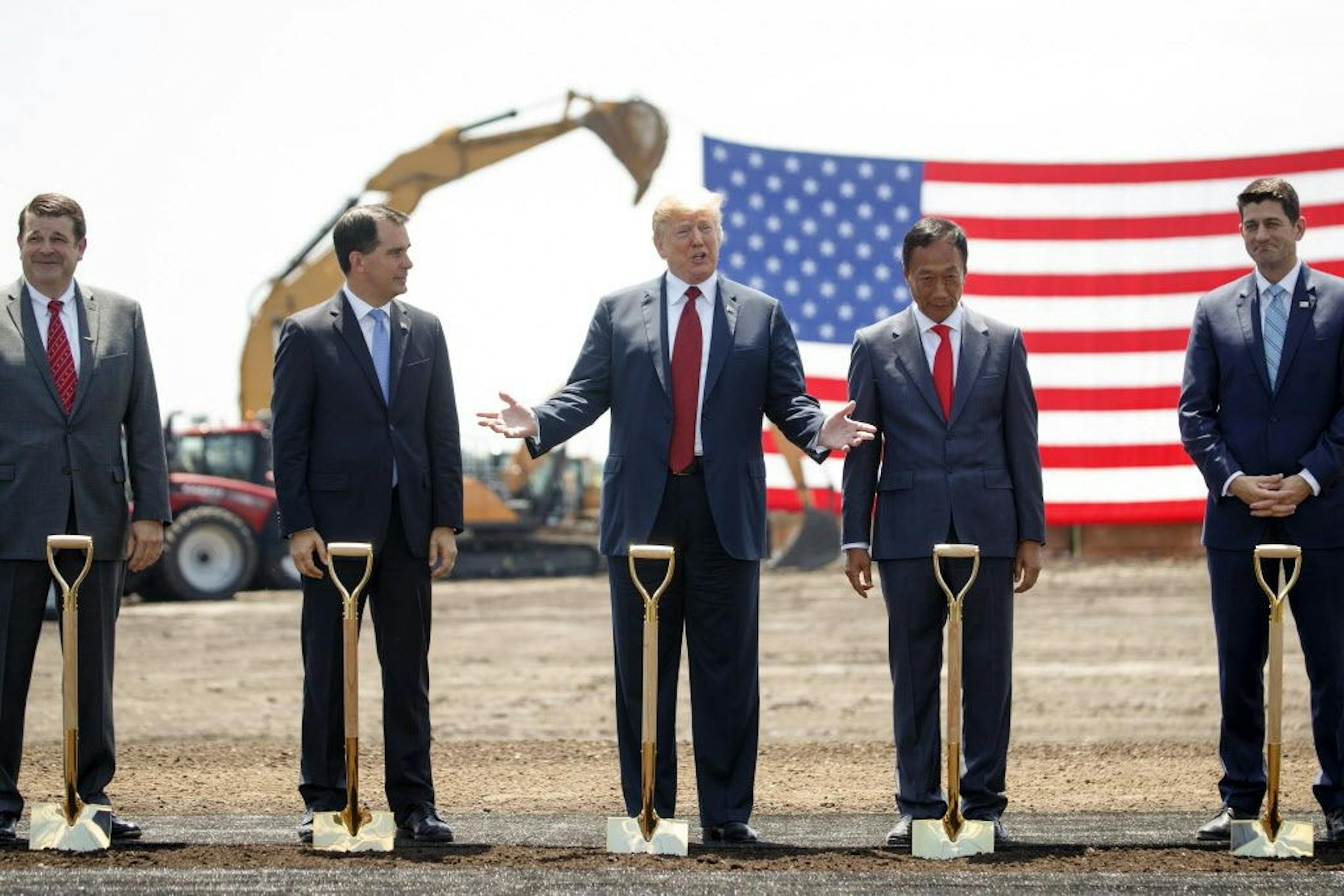 President Donald Trump participates in the groundbreaking for a $10 billiob Foxconn factory complex in Mount Pleasant, Wis., June 28, 2018. From right: House Speaker Paul Ryan (R-Wis.); Terry Gou, chairman of Foxconn; Trump; and Wisconsin Gov. Scott Walker.
