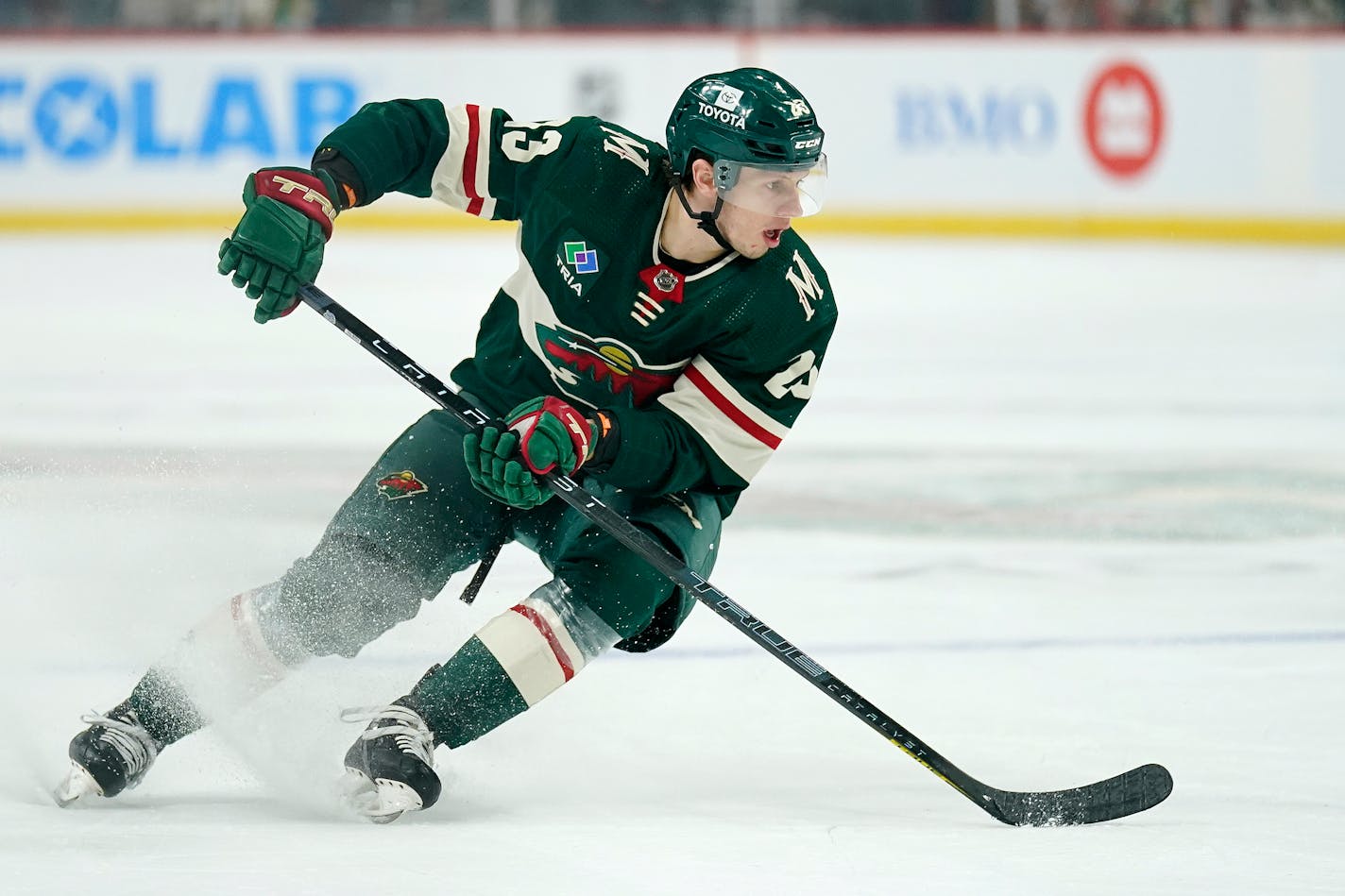 Minnesota Wild center Marco Rossi (23) skates with the puck during the first period of an NHL preseason hockey game against the Dallas Stars, Saturday, Oct. 8, 2022, in St. Paul, Minn. (AP Photo/Abbie Parr)