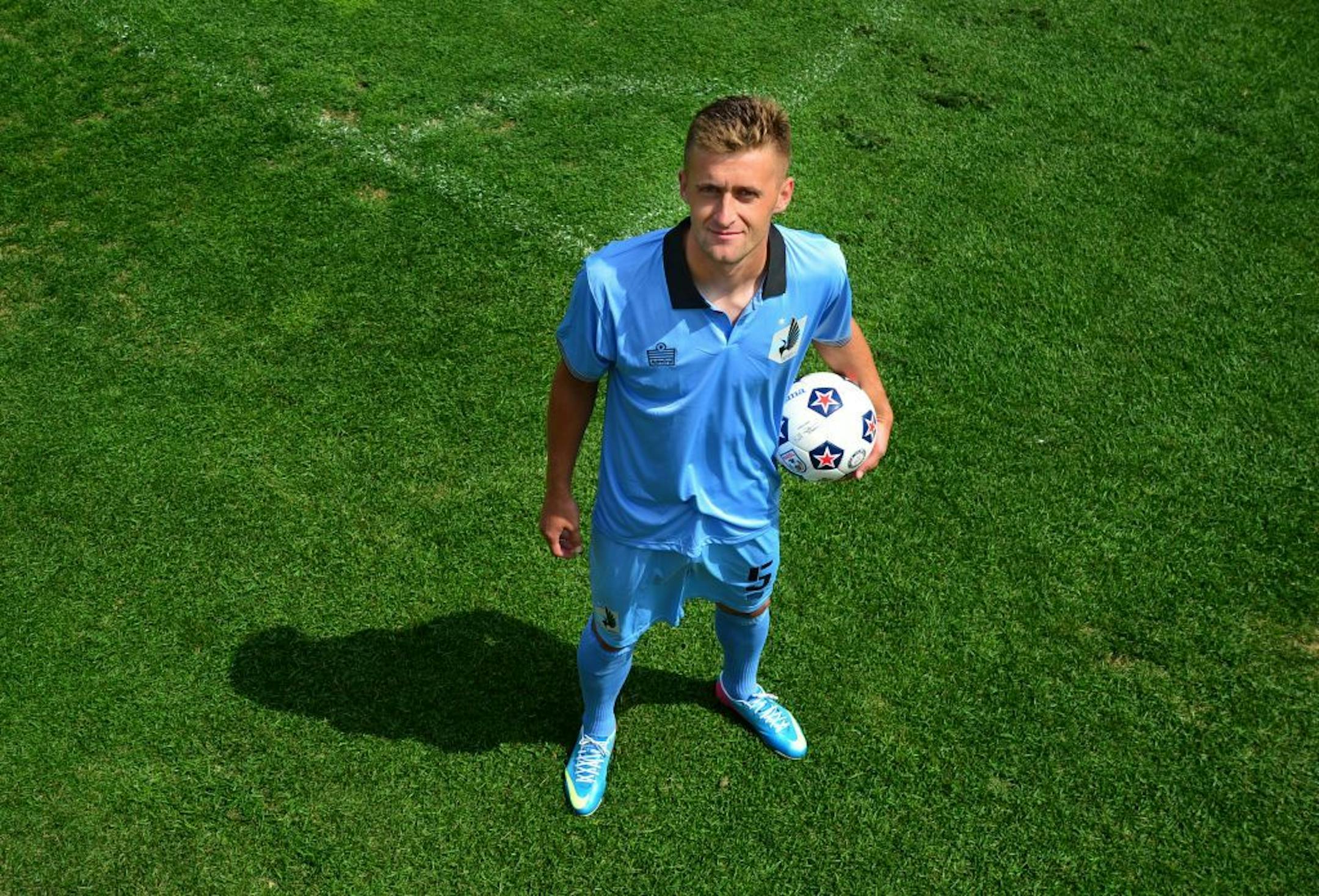 Edi Buro, MN United soccer player, was born in Bosnia and last spring send 50 pair of soccer shoes and other equipment to aid youth near his hometown. He posed for this portrait at the National Sports Center after practice in Blaine, Minn. on Thursday August 15, 2013