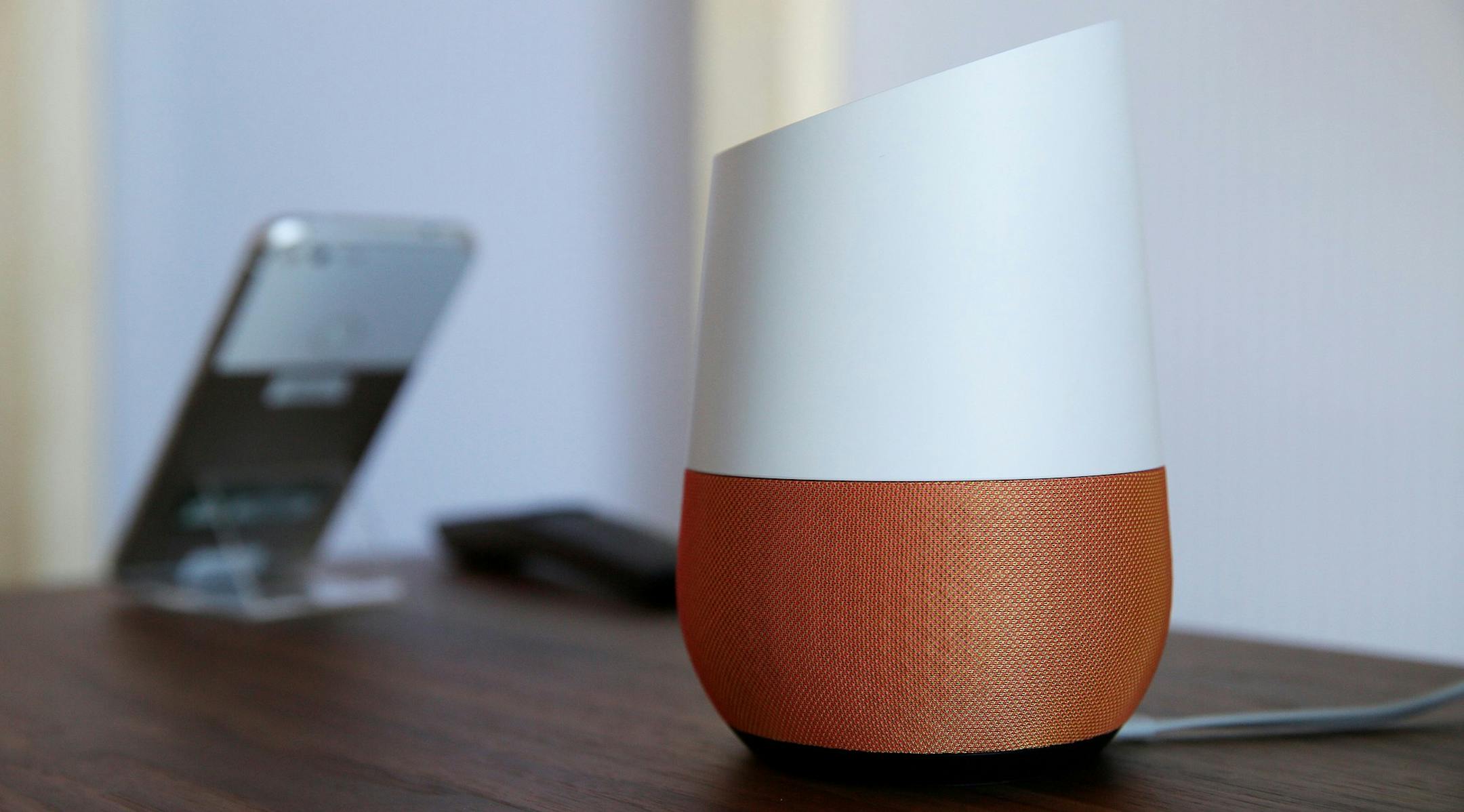 FILE - In this Tuesday, Oct. 4, 2016, file photo, Google Home, right, sits on display near a Pixel phone following a product event, in San Francisco. Voice assistants such as Google Home, Appleís Siri and Amazon Alexa have always been susceptible to accidental hijack. Burger Kingís manipulation of Google Home illustrates the vulnerabilities intrinsic to voice assistants that can be targeted by brands, or worse, hackers. But the stunt might help speed up the next developments for home v