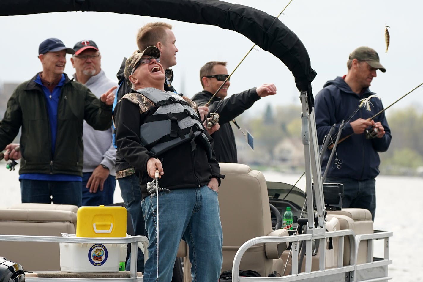 Gov. Tim Walz laughed as he joked with his fishing partners for the day during the Governor's Fishing Opener. ] ANTHONY SOUFFLE • anthony.souffle@startribune.com