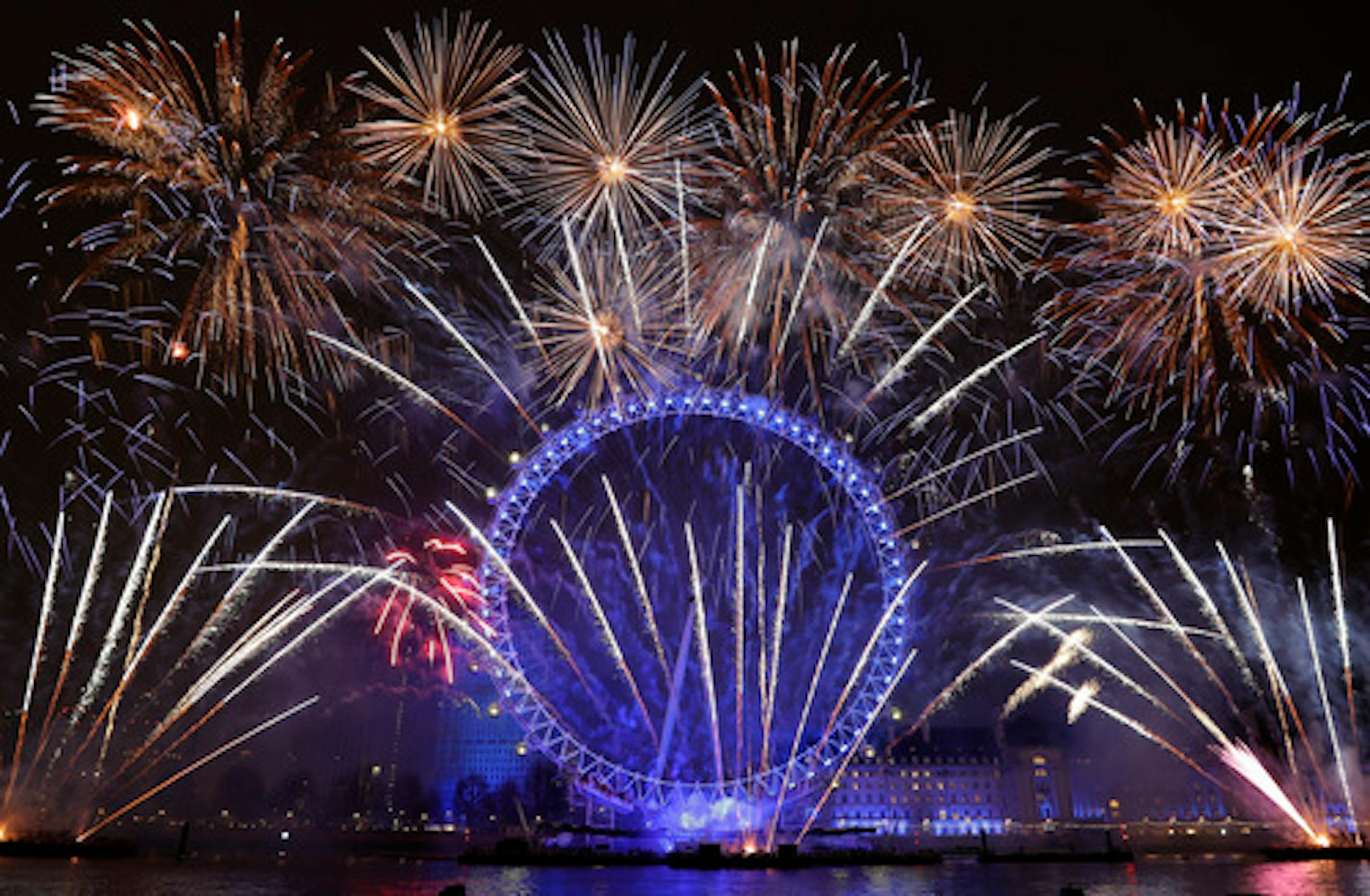 Fireworks explode over the London Eye during the New Year's eve celebrations after midnight in London, Tuesday, Jan. 1, 2019.(AP Photo/Kirsty Wigglesworth)