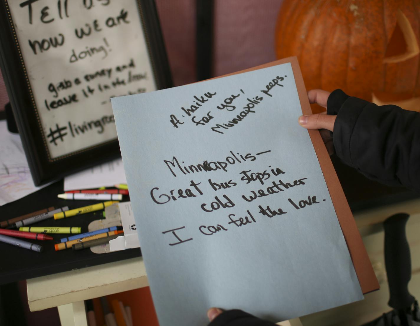 Kathy DeKrey, project manager for the Musicant Group, one of the developers of the concept, staffs the Living Room Station Wednesday afternoon. She showed one of the notes of appreciation that was left behind by a visitor. ] JEFF WHEELER &#xef; jeff.wheeler@startribune.com A kind of pop up bus stop, Living Room Station, Your Home Before You Get Home, on 6th St. S. at the Nicollet Mall was created as part of a larger initiative by the Downtown Improvement District (DID) in partnership with Metro