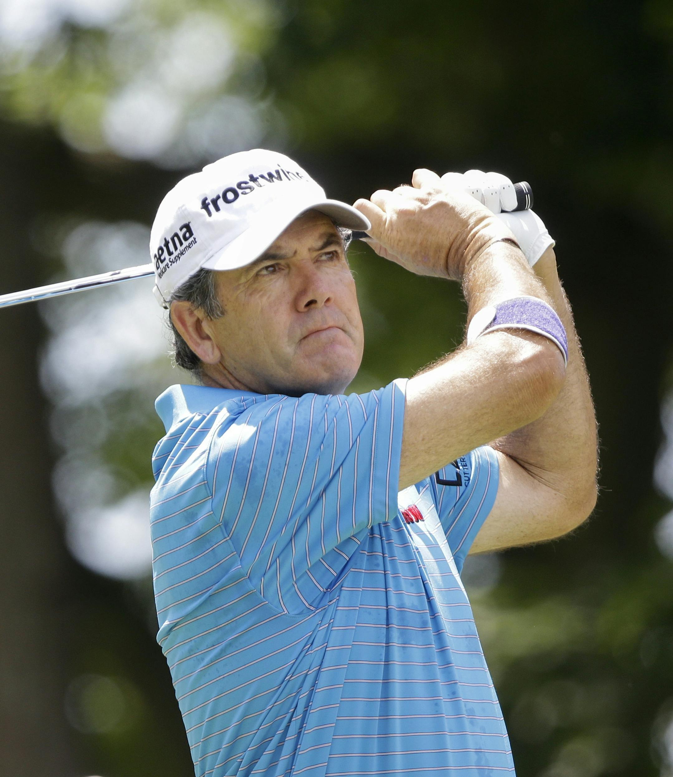 David Frost of South Africa tees off on the third hole Sunday, July 14, 2013, in the final round of the U.S. Senior Open golf tournament in Omaha, Neb. (AP Photo/Nati Harnik) ORG XMIT: MIN2013072701085313