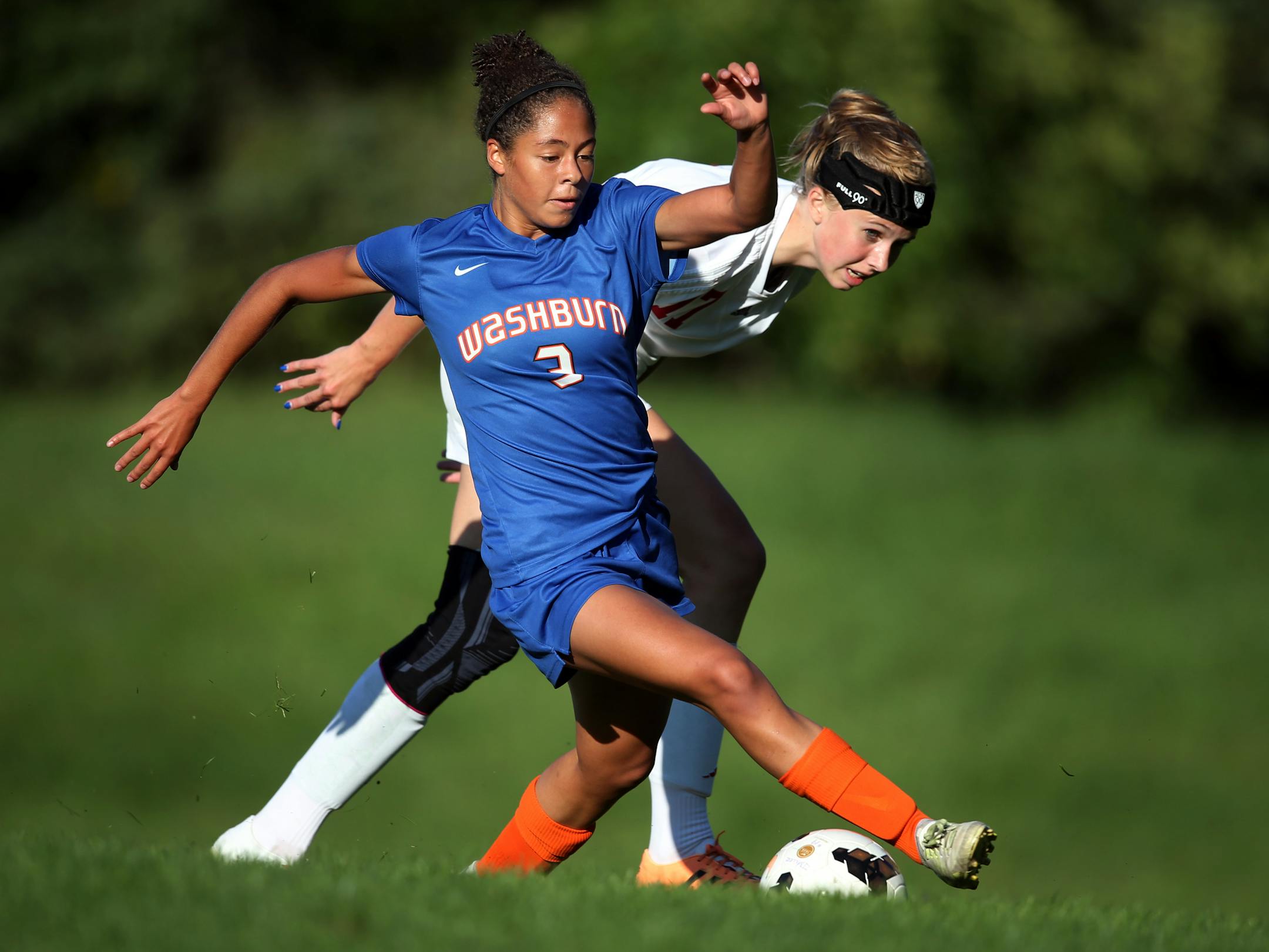 Mari Rajacich kicked the ball away from Megan King of Visitation (Jerry Holt, Star Tribune)