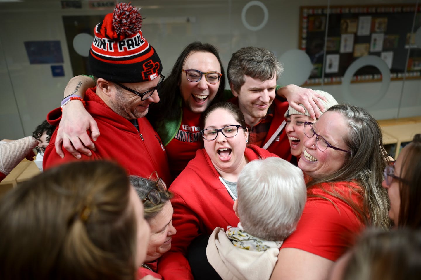 Members of the Saint Paul Federation of Educators bargaining team celebrated their tentative agreement following a press conference Tuesday at Maxfiel