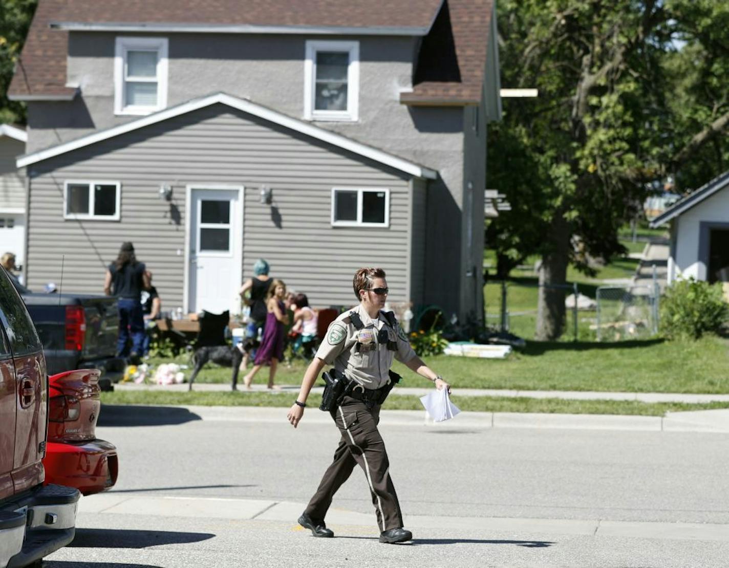 A Meeker county Sheriff's deputy walked past the home where 5-year-old Alayna Ertl lived Sunday, August 21, 2016 in Watkins, MN.