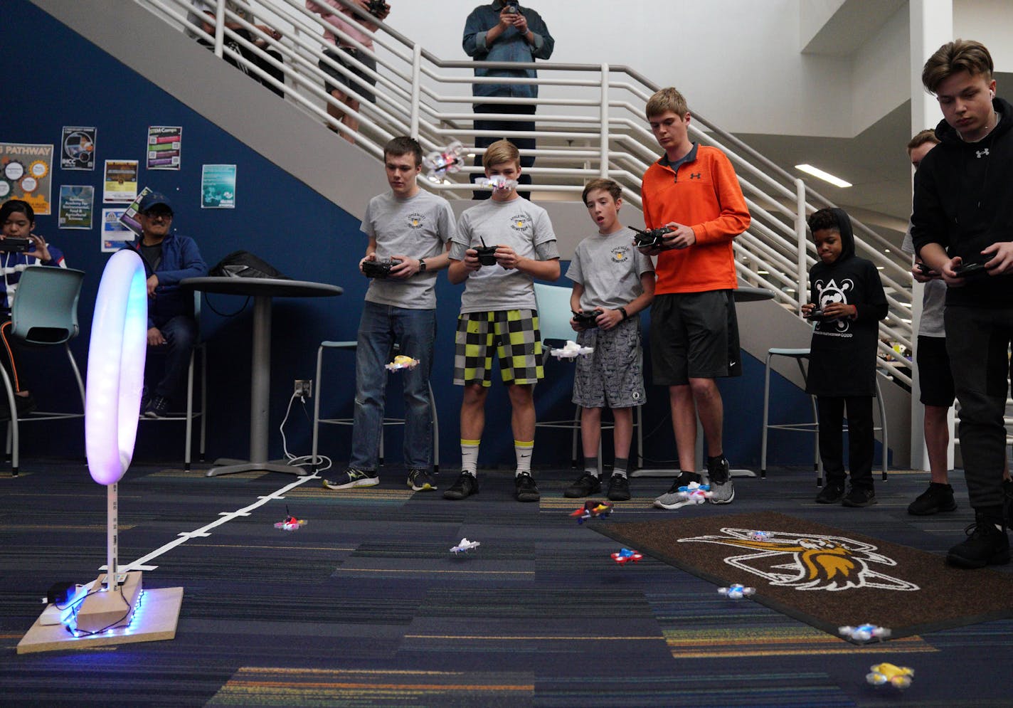 Students flew their drones at the start of the line of sight race that requires students to follow their drones in flight, keeping a visual on them at all times, rather than wearing fist person view goggles. ] ANTHONY SOUFFLE &#x2022; anthony.souffle@startribune.com Students from Apple Valley High School and St. Louis Park High School took part in the first ever Minnesota high school drone racing tournament Saturday, May 18, 2019 at Apple Valley High School in Apple Valley, Minn.