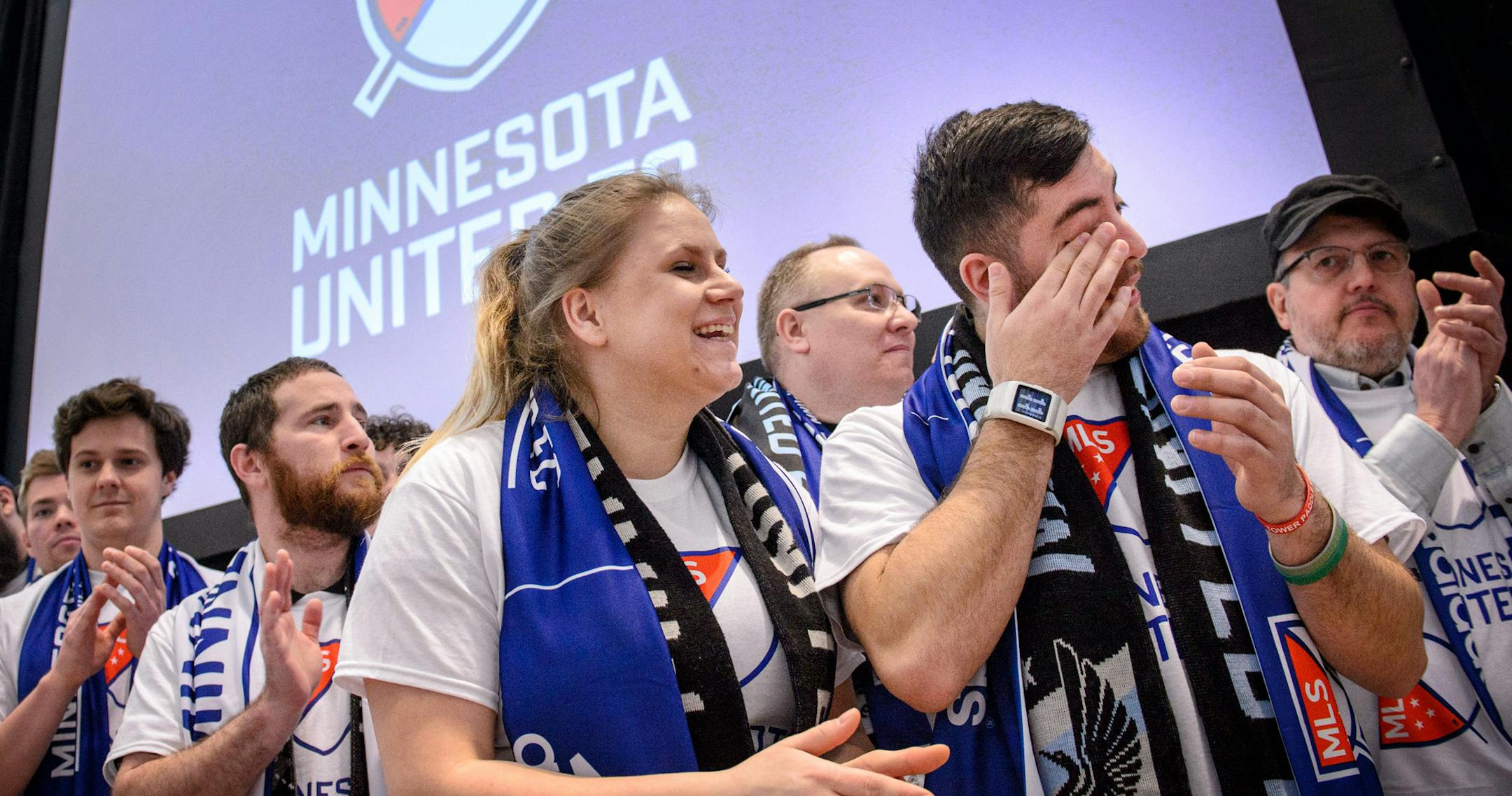 Cassie Benson laughed as her boyfriend Manny Chavez wiped away tears and the announcement to bring soccer to Minnesota was made. ] GLEN STUBBE * gstubbe@startribune.com Wednesday, March 25, 2015 Major League Soccer, Commissioner Don Garber and Dr. Bill McGuire announced that Minnesota will be awarded an expansion soccer team.