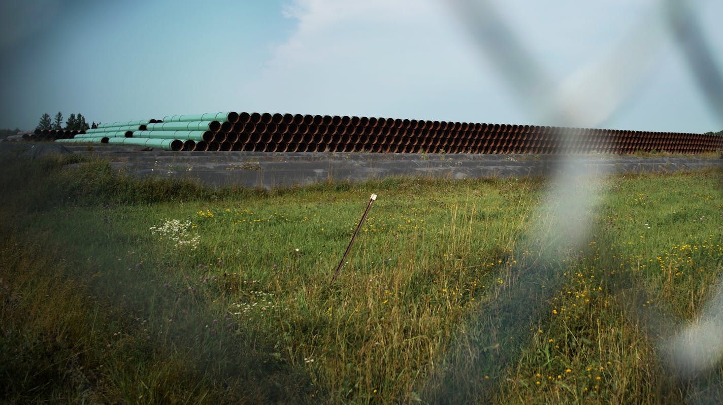 A staging area for pipes owned by Enbridge is behind a closed fence in Cloquet.]Enbridge already has started building the 14-mile stretch of Line 3 from the Minnesota line to its terminal in Superior, Wis.Richard Tsong-Taatarii &#xef; richard.tsong-taatarii@startribune.com