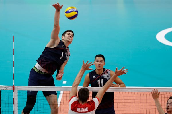 United States' Matthew Anderson goes up to spike the ball in a men's quarterfinal volleyball match against Poland at the 2016 Summer Olympics in Rio d