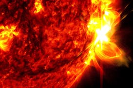 This image provided by NASA's Solar Dynamics Observatory shows a solar flare, right, on May 14, 2024, captured in the extreme ultraviolet light portio