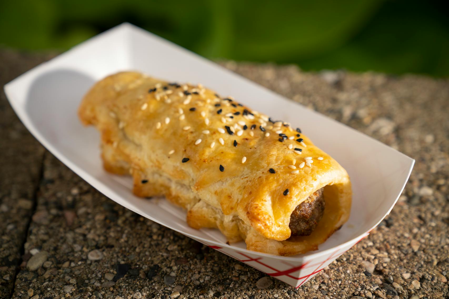 A Rockin’ Sausage Roll from Sausage Sister & Me. The new foods of the 2023 Minnesota State Fair photographed on the first day of the fair in Falcon Heights, Minn. on Tuesday, Aug. 8, 2023. ] LEILA NAVIDI • leila.navidi@startribune.com