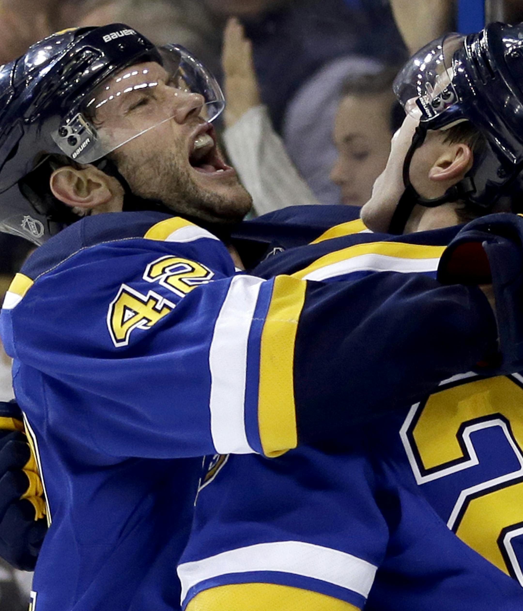 Blues captain David Backes, left.