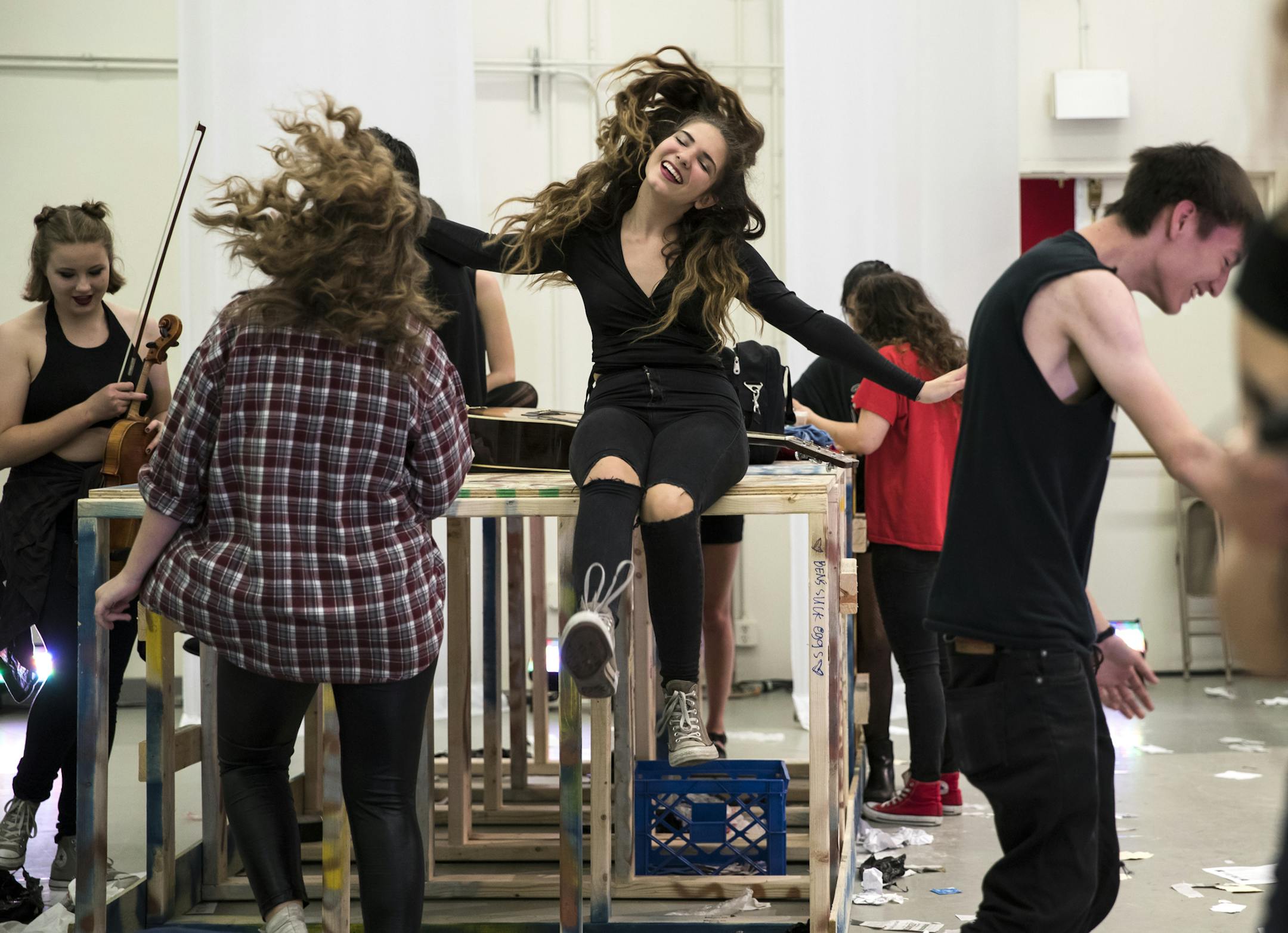 Giselle Durand, 17, Bella Blackshaw, 15, center, and Evan Willie, 17, right, danced to the snoopy theme song played on the piano by a pit member before the show Thursday night, June 16, 2016 show at JSB Tek Box in Minneapolis, Minn. ] RENEE JONES SCHNEIDER • reneejones@startribune.com With zero adult assistance, a group of metro area high school students produced, directed, performed and raised the funds to perform the musical "American Idiot," running June 15-18. They are part of a theat