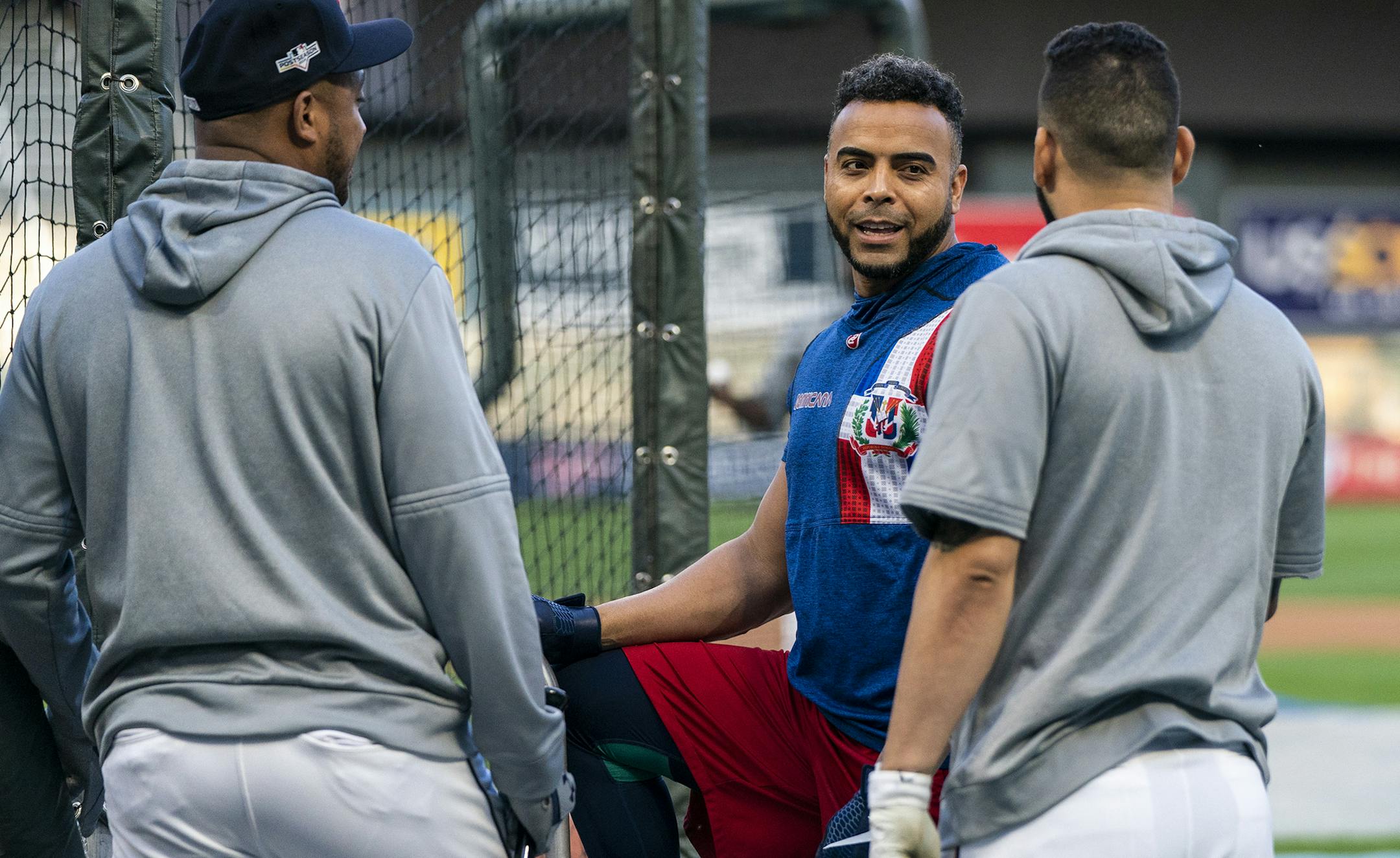 Minnesota Twins designated hitter Nelson Cruz (23), second from left, talks with second baseman Jonathan Schoop (16), from far left, infielder Marwin Gonzalez (9) and shortstop Jorge Polanco (11) during the Twins workout. ] LEILA NAVIDI • leila.navidi@startribune.com BACKGROUND INFORMATION: Workout day and media availability for the Twins and the Yankees ahead of Game 3 of their ALDS matchup at Target Field in Minneapolis on Sunday, October 6, 2019.