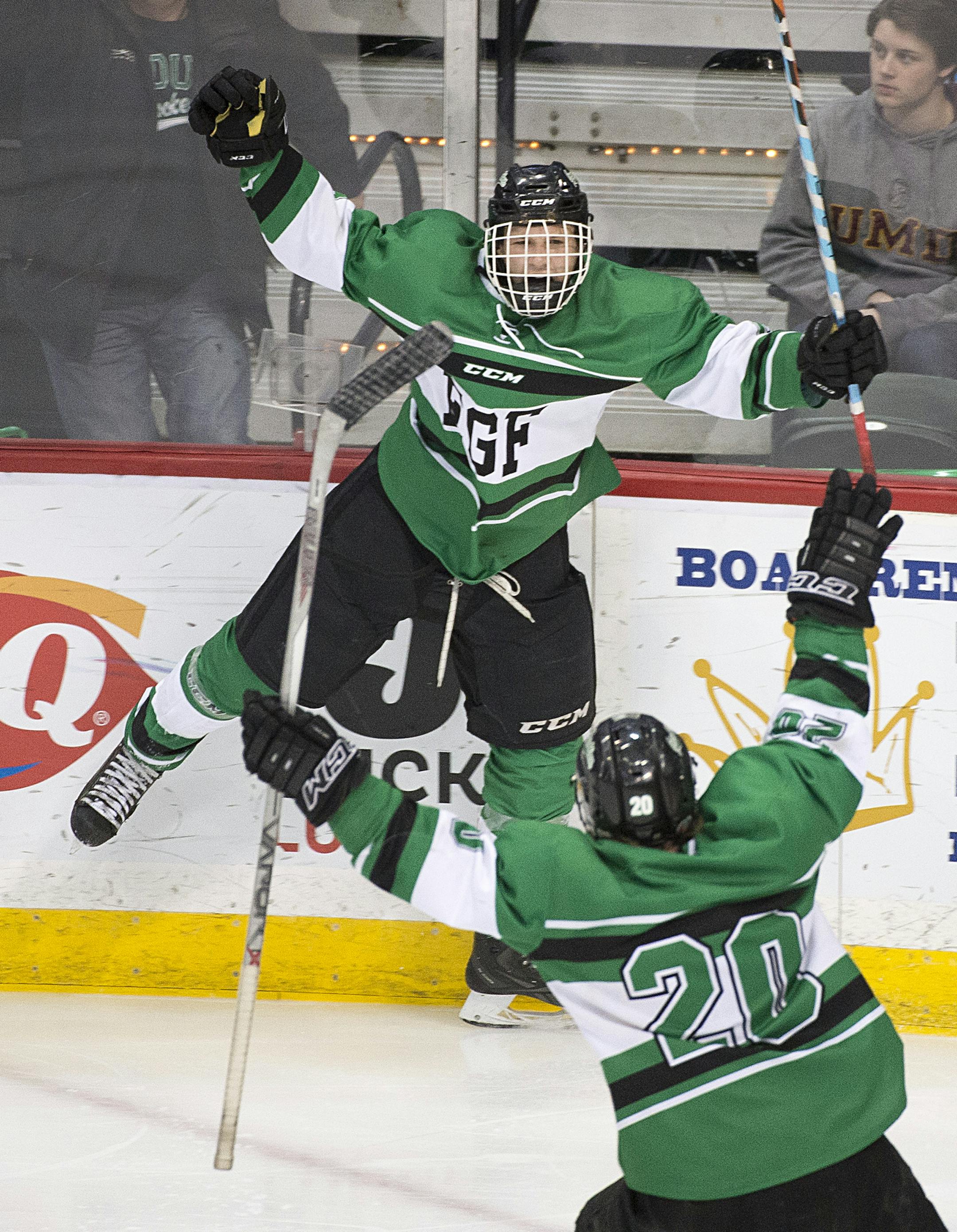 East Grand Forks center Austin Monda (8) and East Grand Forks wing Reed Corbid (20) celebrate a goal scored by Monda against Hermantown in the third period. ] (Aaron Lavinsky | StarTribune) Hermantown plays East Grand Forks in the Class 1A boys' hockey state championship game on Saturday, March 7, 2015 at Xcel Energy Center.