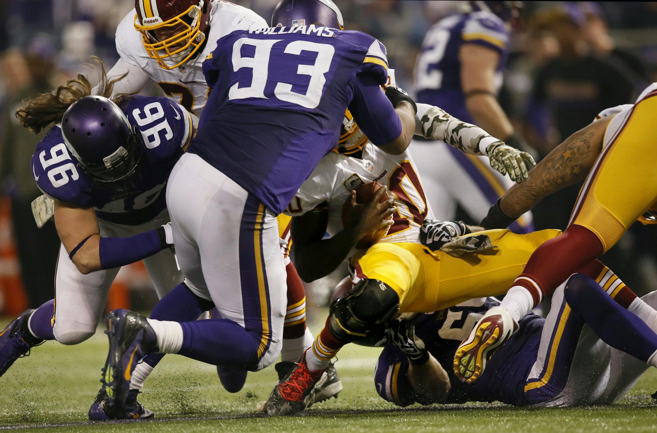 Viking's Kevin Williams puts the sack on Washington quarterback Robert Griffin III in the 4th quarter. ] Minnesota Vikings vs Washington Redskins - Minneapolis Metrodome Minneapolis, WI - 11/07//2013