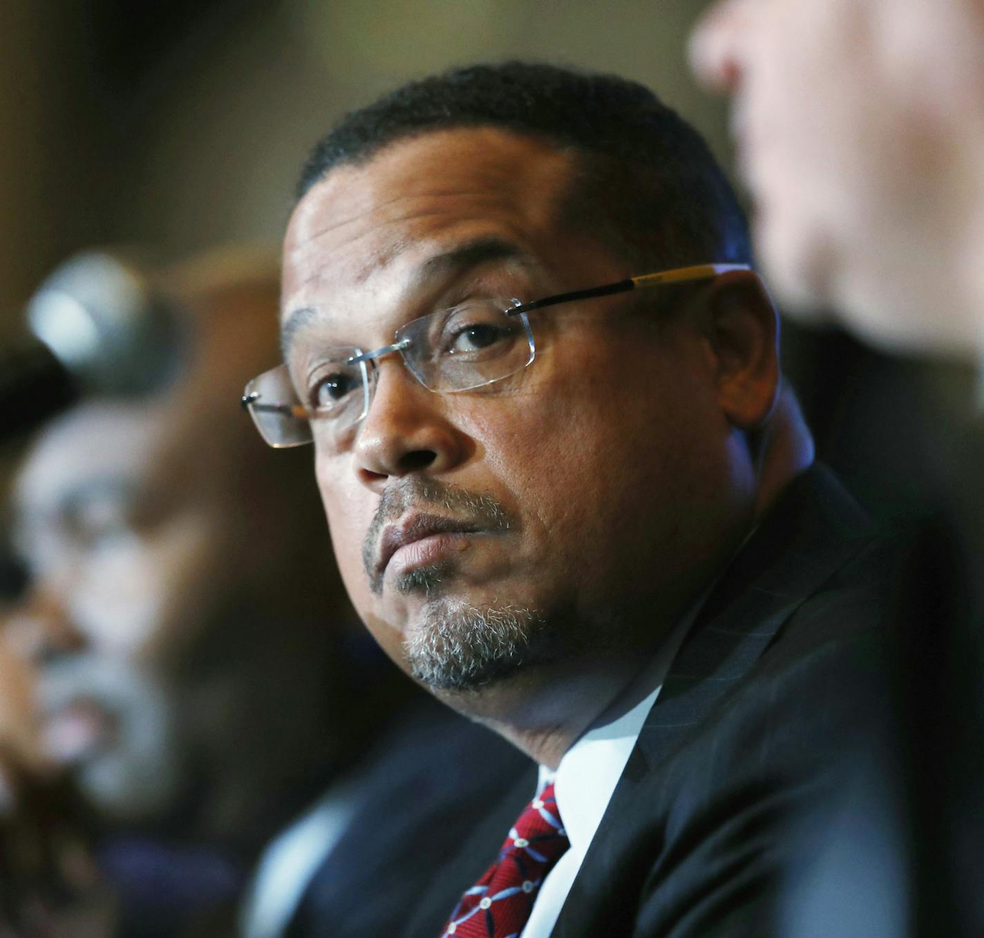 FILE - In this Dec. 2, 2016 file photo, U.S. Rep. Keith Ellison, D-Minn., listens during a forum on the future of the Democratic Party, in Denver. Ellison, who is currently running to be the next chair of the Democratic National Committee, announced Monday, Jan. 16, 2017, he is boycotting Donald Trump's presidential inauguration on Friday. (AP Photo/David Zalubowski, File)