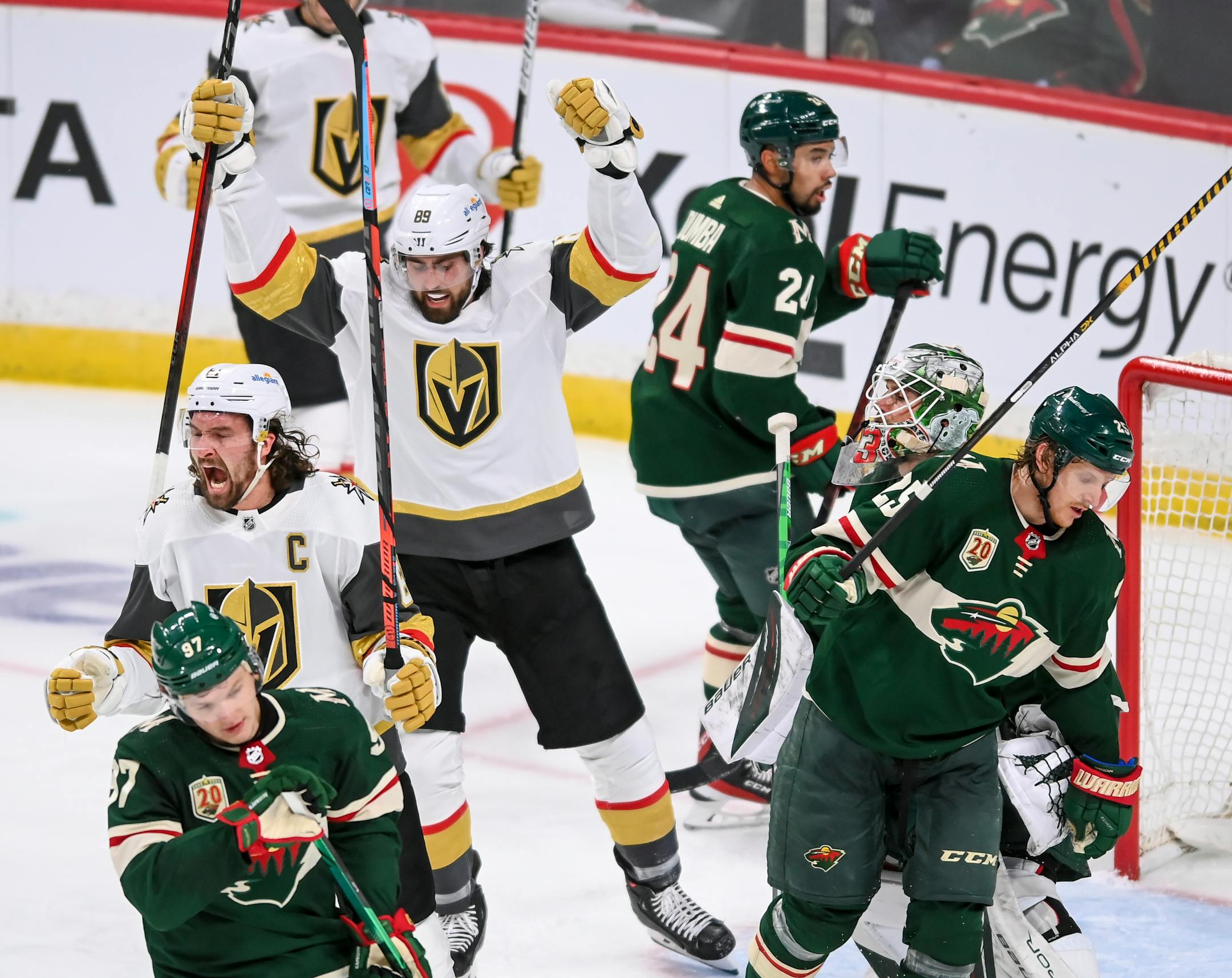 Vegas Golden Knights right wing Mark Stone (61), left, celebrated after scoring the team's first goal against the Wild in the second period.