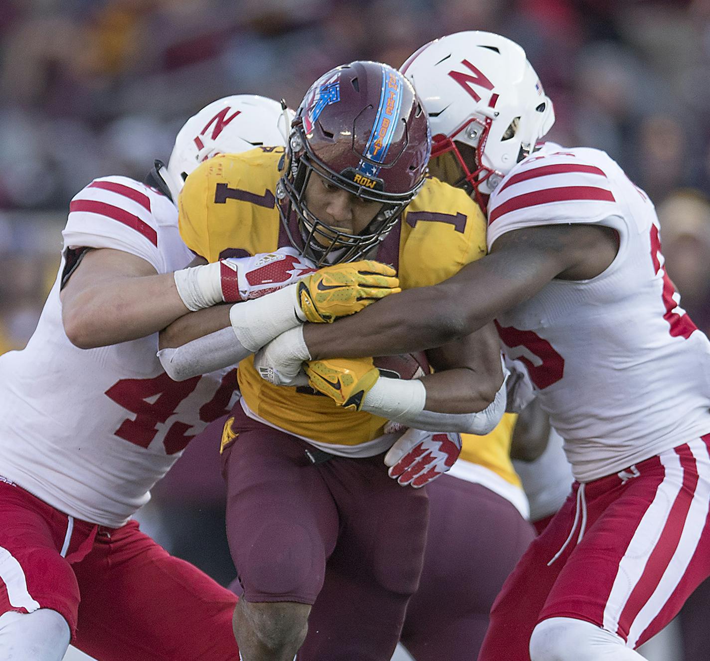 Minnesota's running back Rodney Smith plowed through Nebraska's defensive lineman A.J. Natter, left, and Antonio Reed, right, during the third quarter as the Gophers took on Nebraska, Saturday, November 11, 2017 at TCF Bank Stadium in Minneapolis, MN. ] ELIZABETH FLORES &#xef; liz.flores@startribune.com