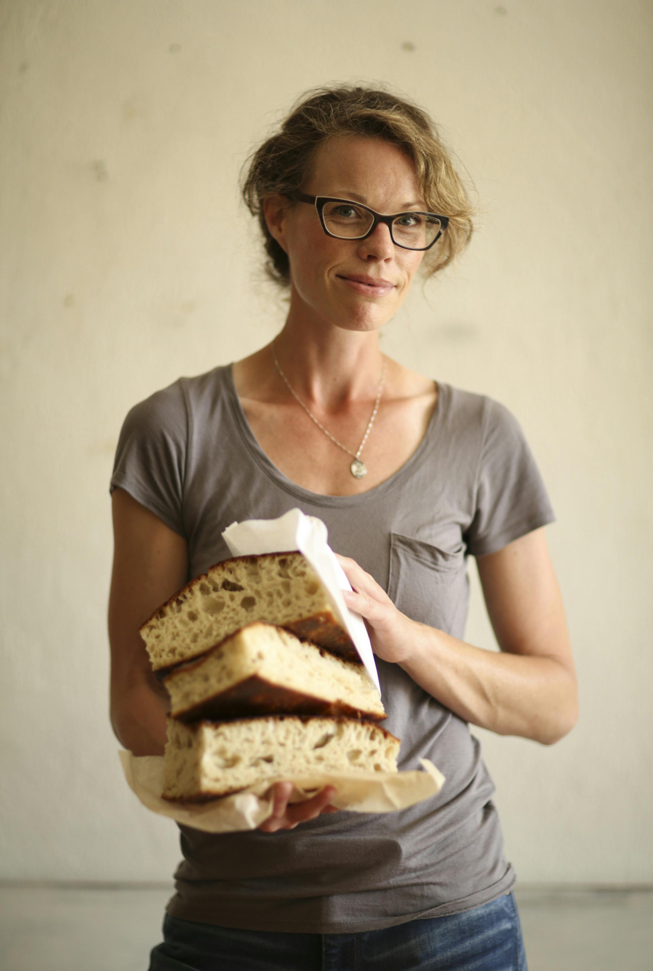 Sarah Botcher with naturally fermented focaccia at her Black Walnut Bakery. JEFF WHEELER • jeff.wheeler@startribune.com