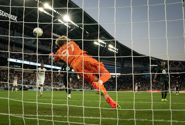 Minnesota United FC goalkeeper Dayne St. Clair (97) stops the ball in the first half.