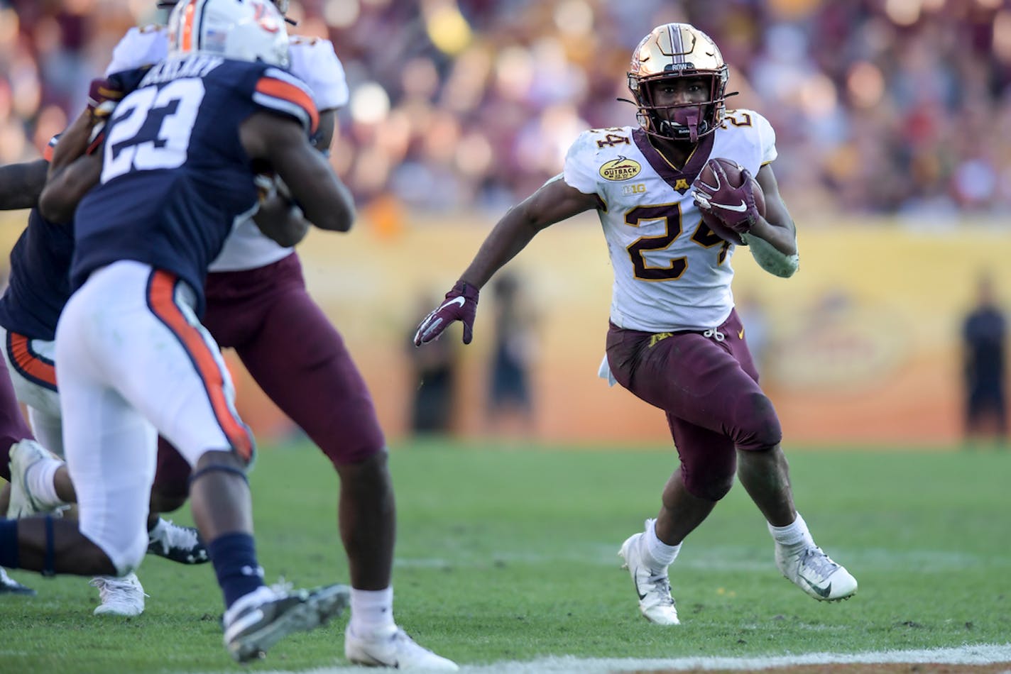 Rrunning back Mohamed Ibrahim (24) ran for a first down in the fourth quarter against the Auburn Tigers.