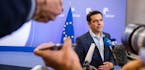 Greek Prime Minister Alexis Tsipras speaks with the media after a meeting of eurozone heads of state at the EU Council building in Brussels on Monday,
